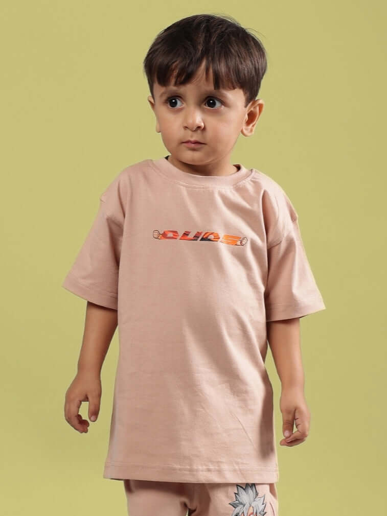Young child wearing a beige Gohan t-shirt for boys & girls by DUDS, featuring a colorful chest print, available in custom fit.