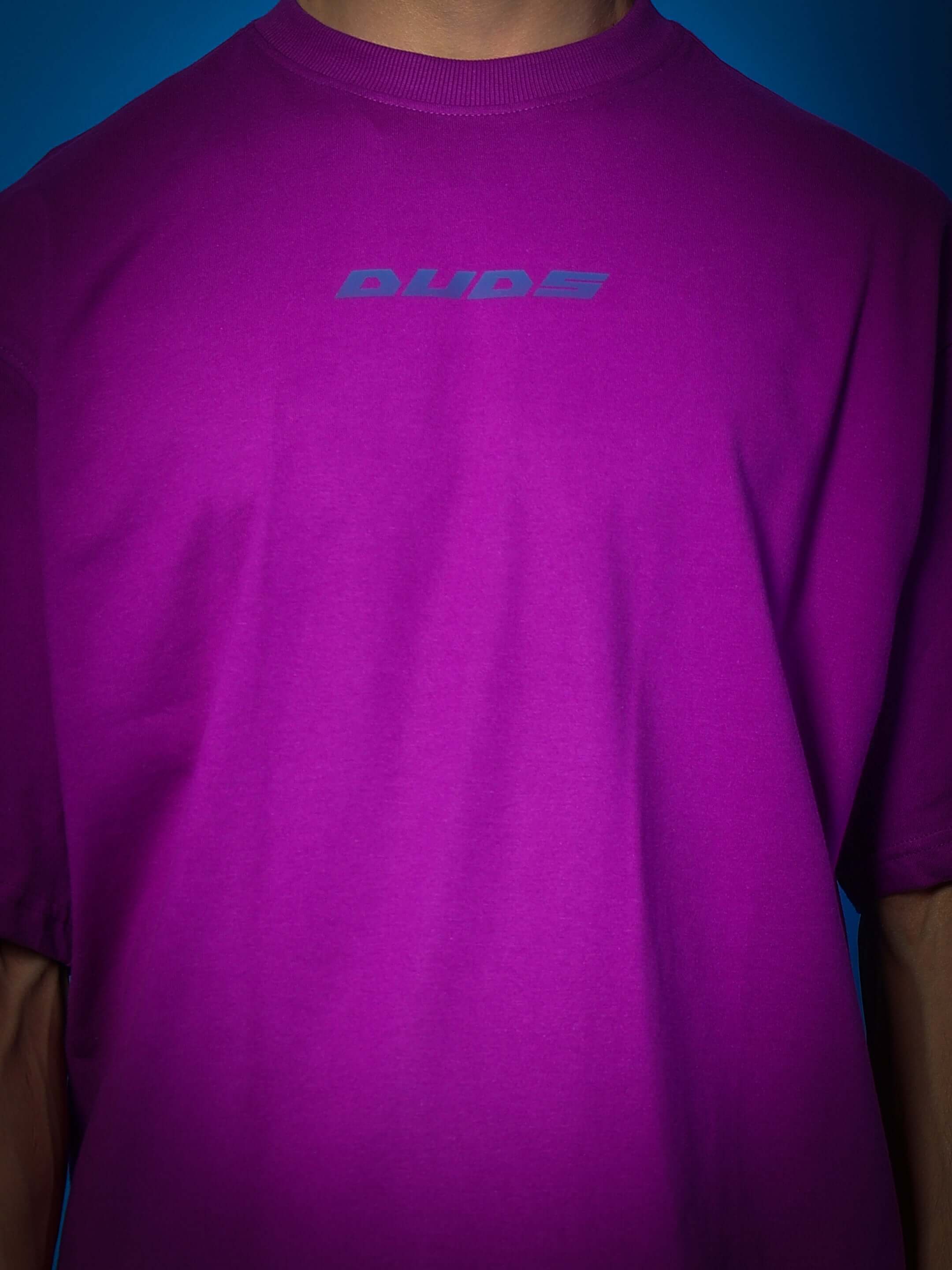 INTERTWINED SNAKE REFLECTOR OVER-SIZED T-SHIRT PURPLE with DUDS logo displayed in close-up view.