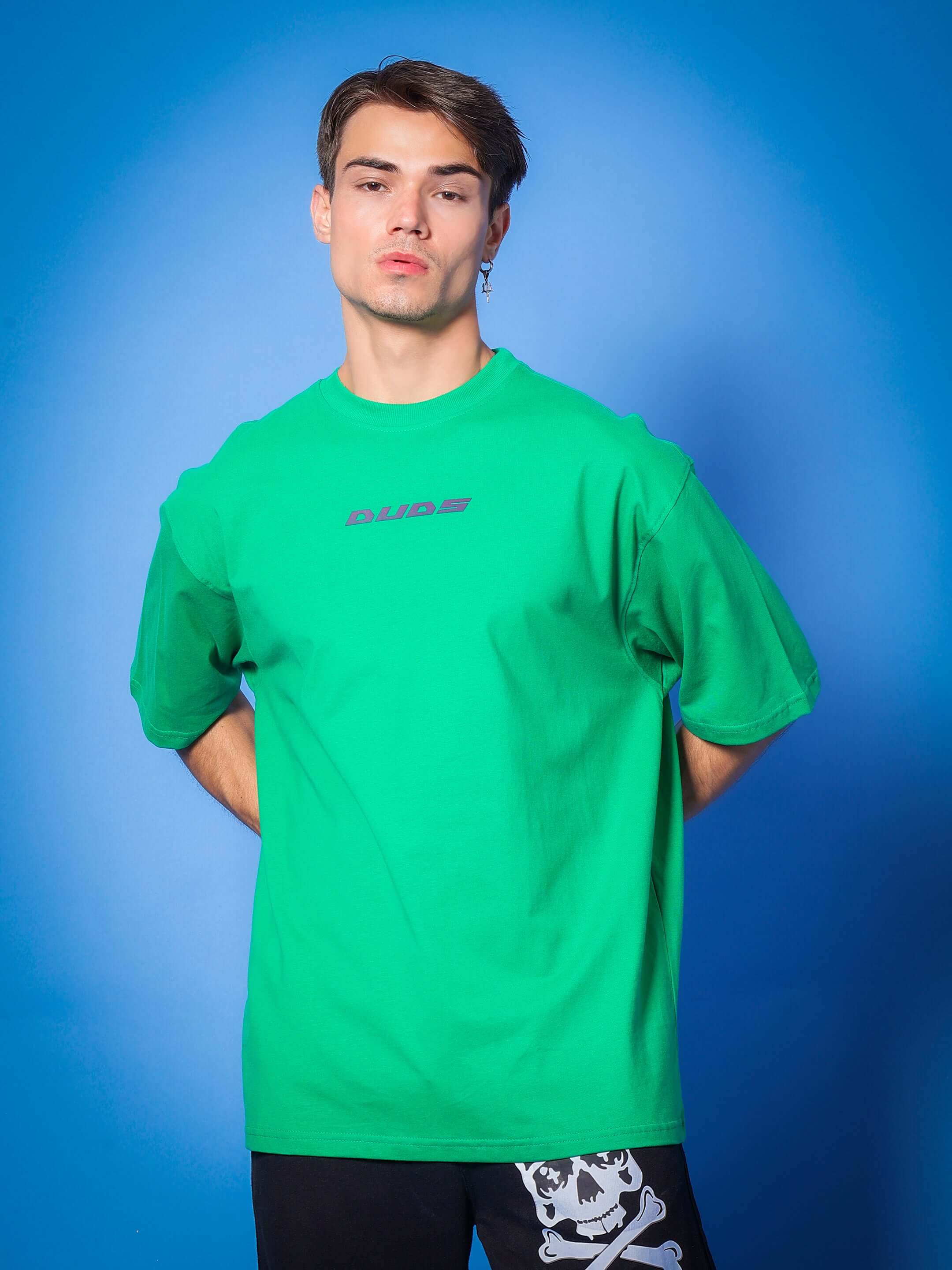 Model wearing MEDUSA GAZE REFLECTOR EYE OVER-SIZED T-SHIRT GREEN with custom fit option