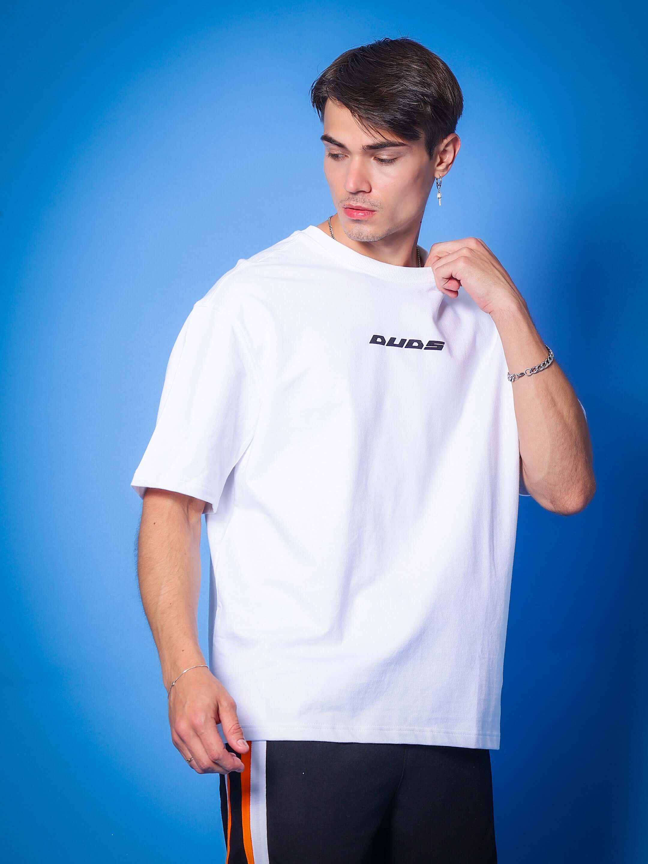 MIND & SPIRIT GOTHIC ART PRINT OVER-SIZED T-SHIRT WHITE in premium cotton fabric, worn by a model against a blue background