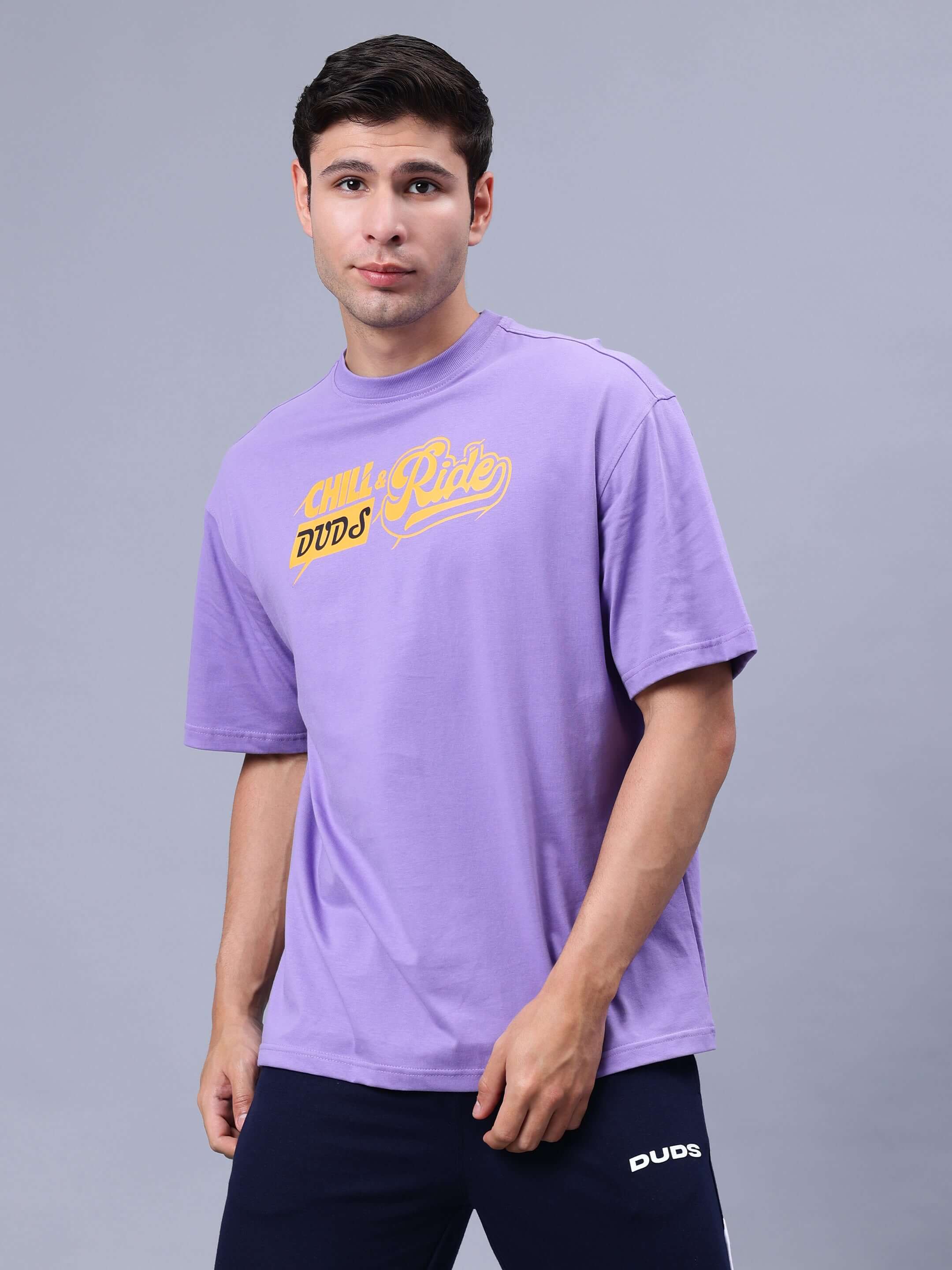 Man wearing DUDS CHILL & RIDE OVER-SIZED T-SHIRT LAVENDER