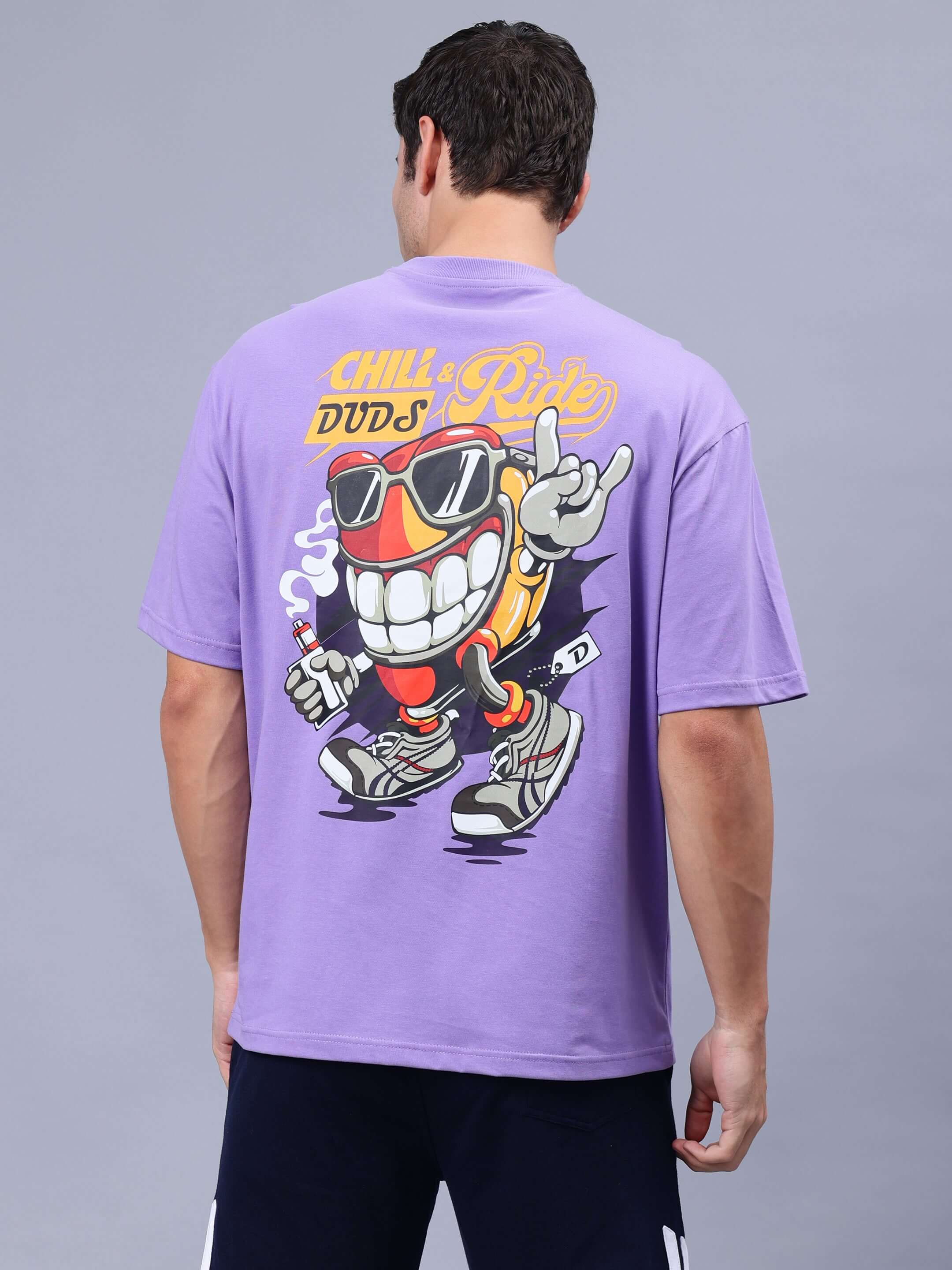 Man wearing DUDS CHILL & RIDE OVER-SIZED T-SHIRT LAVENDER with graphic design
