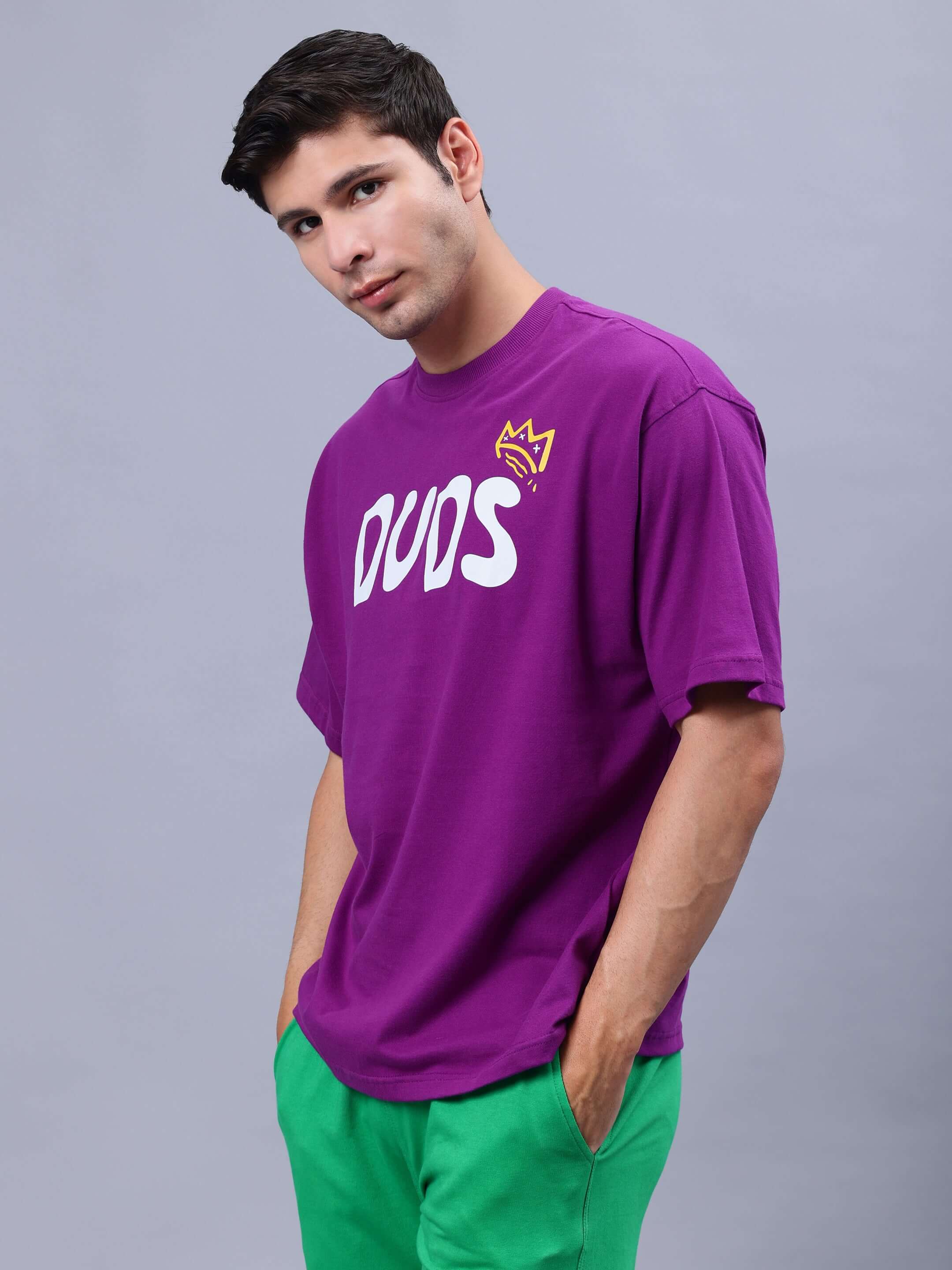 MAKE MONEY NOT FRIENDS OVER-SIZED T-SHIRT PURPLE in premium cotton fabric, worn by a model, showcasing casual style.