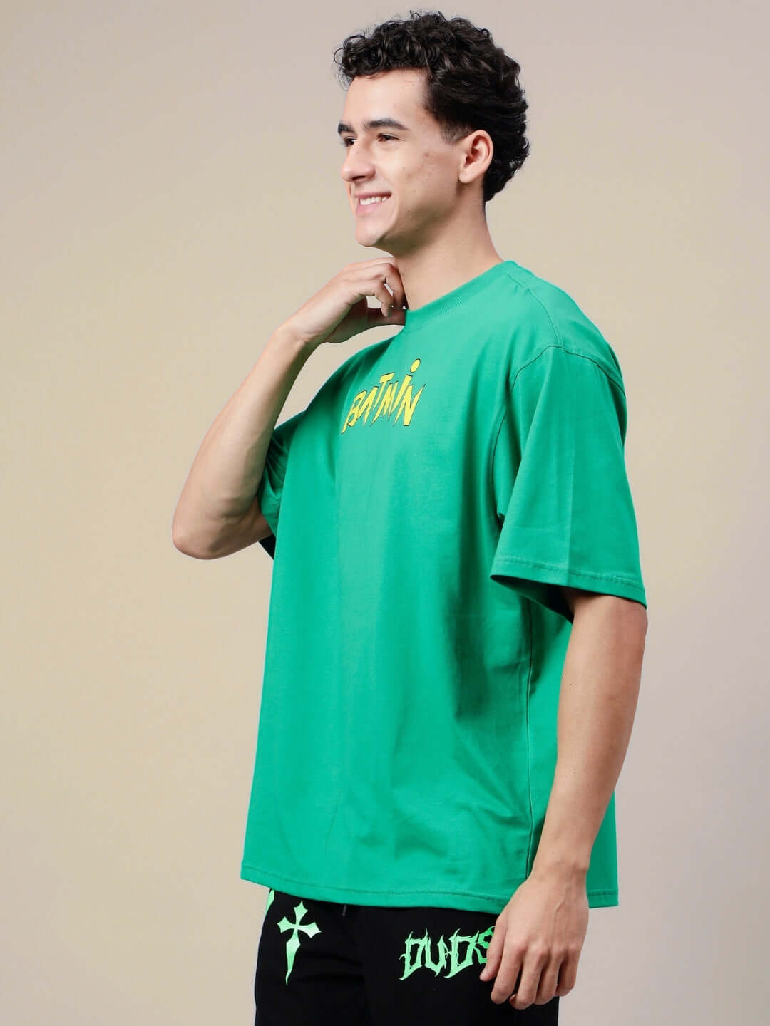 Model wearing BATMIN OVER-SIZED T-SHIRT GREEN with custom fit option available.