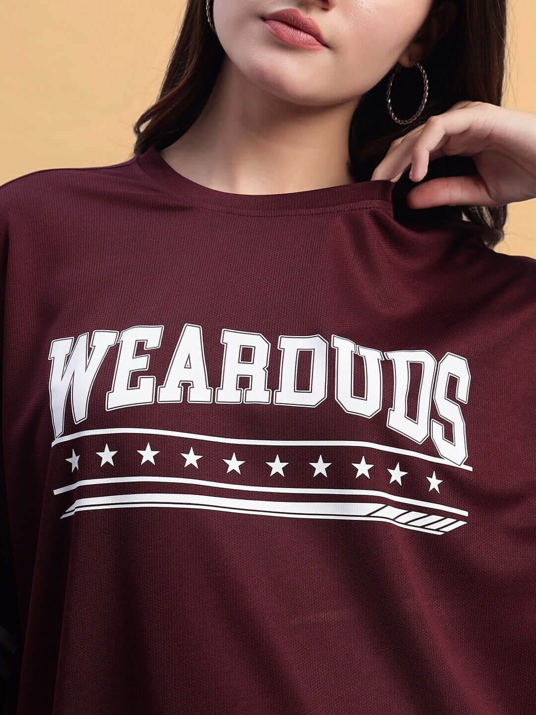 Women's wine colorblock co-ord set in sports polyester fabric with 'WEARDUDS' graphic, featuring a relaxed fit and cold wash care.