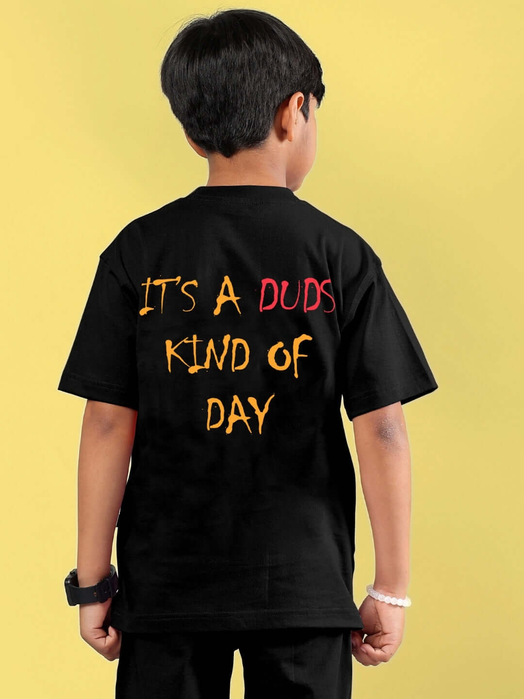 Boy wearing black funny chicken printed t-shirt with text 'It's a Duds kind of day' from DUDS collection.