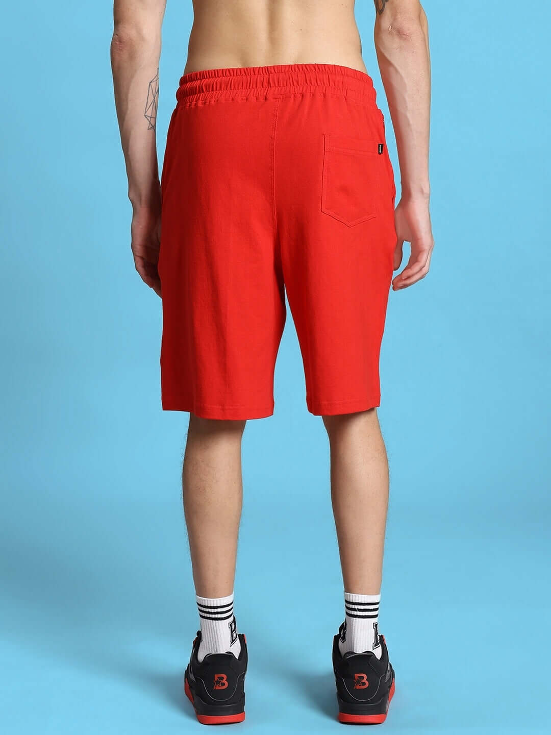 ACRO summer shorts in red, back view; tailored fit, breathable fabric, ideal for casual outings.