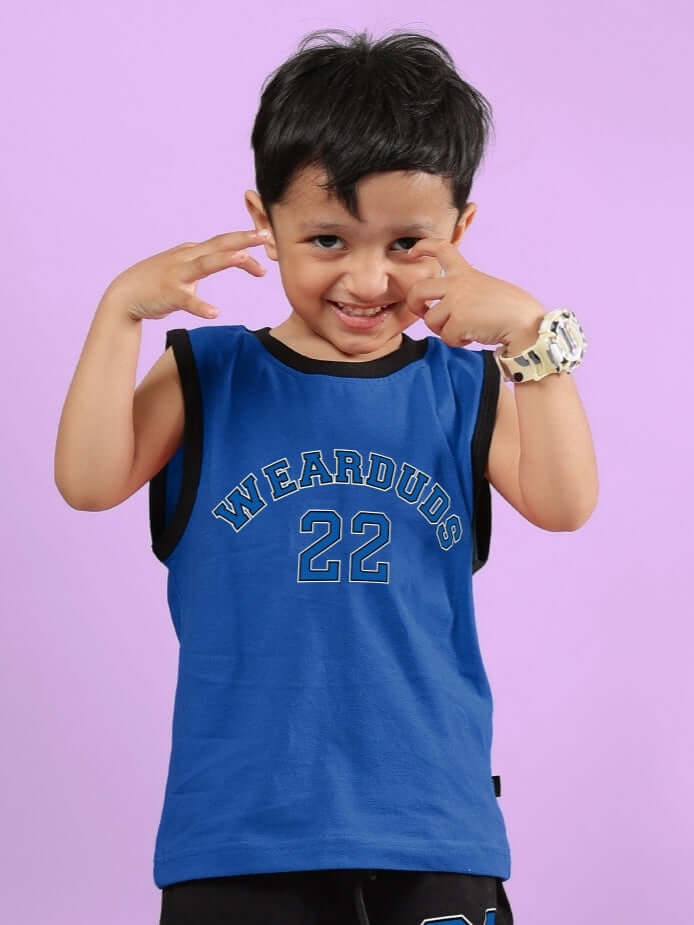 Smiling child wearing a blue Amiga t-shirt by DUDS, displaying comfort and style for boys and girls. Made to order. Custom fit available.