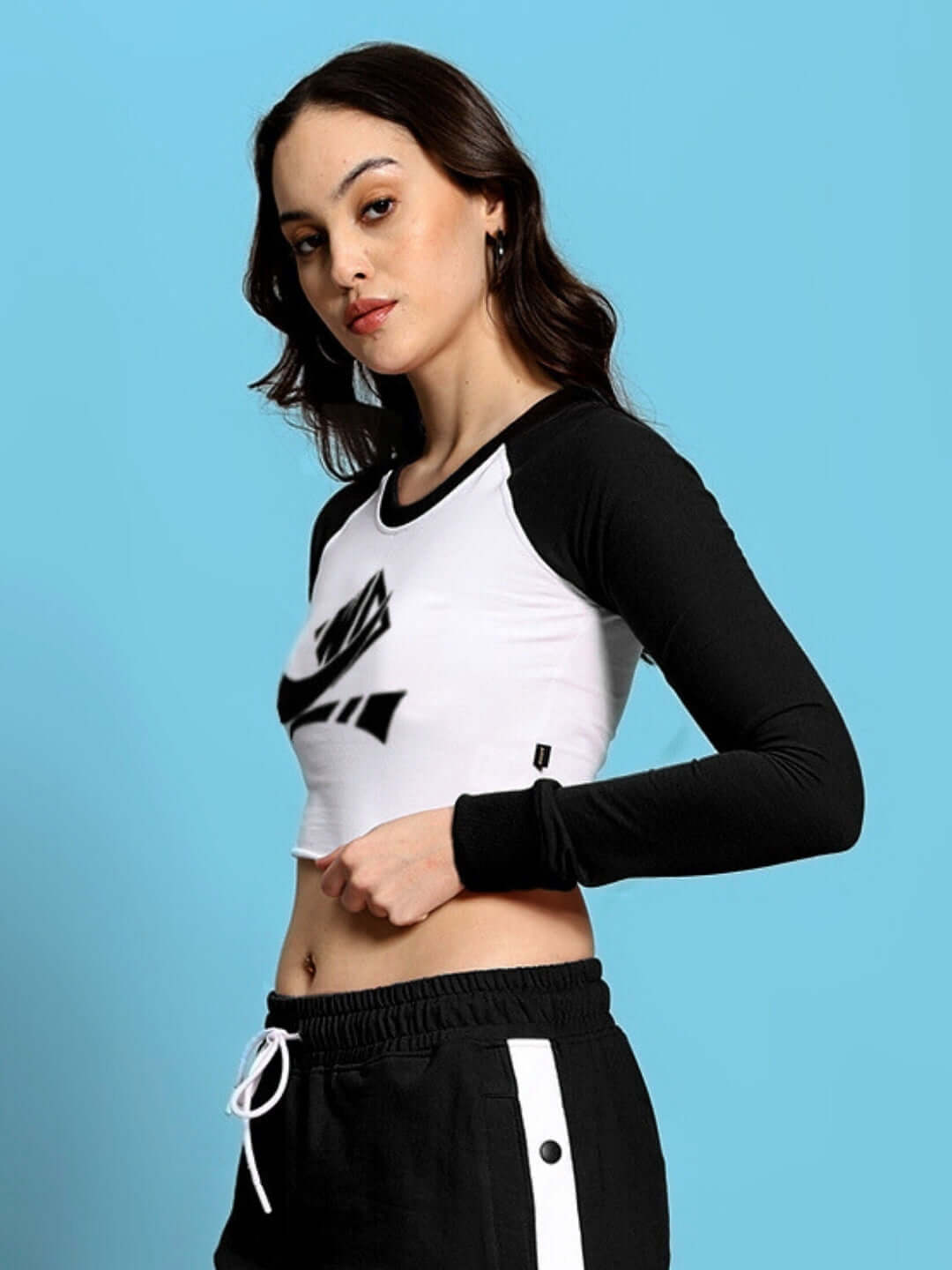 Model wearing black and white Women's Ezel Solid Regular Sleeves Top, showcasing stylish premium fabric. Ideal for casual wear.
