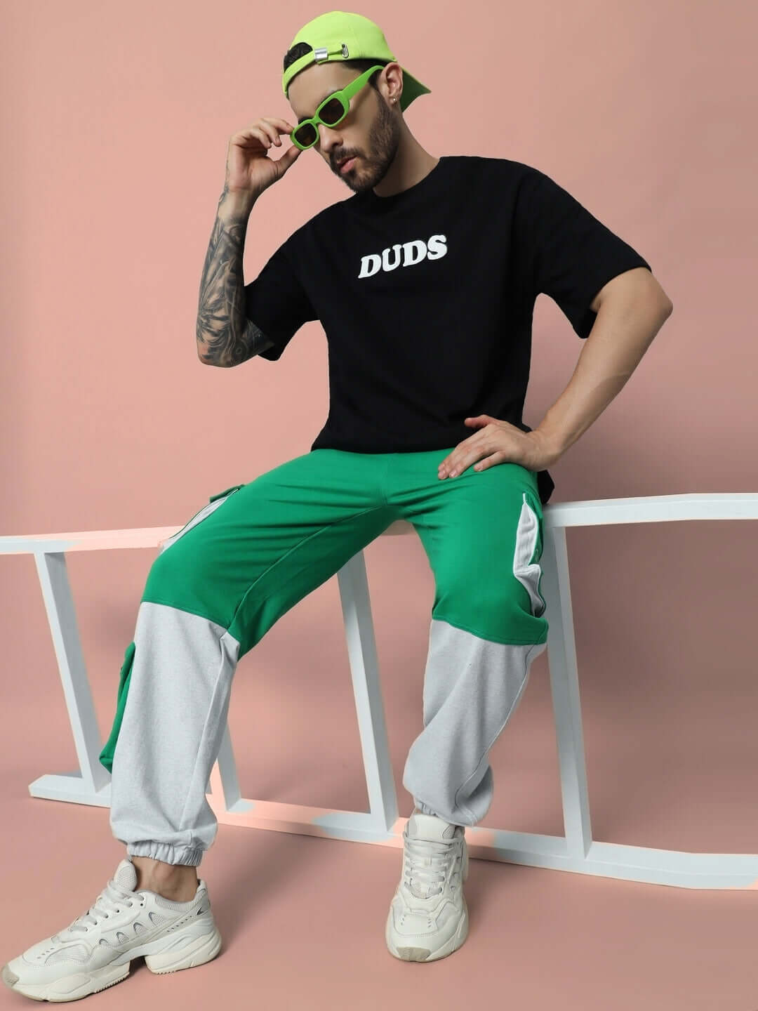 Model wearing SKYSCRAPER RELAXED FIT CARGO PANT GREEN by DUDS