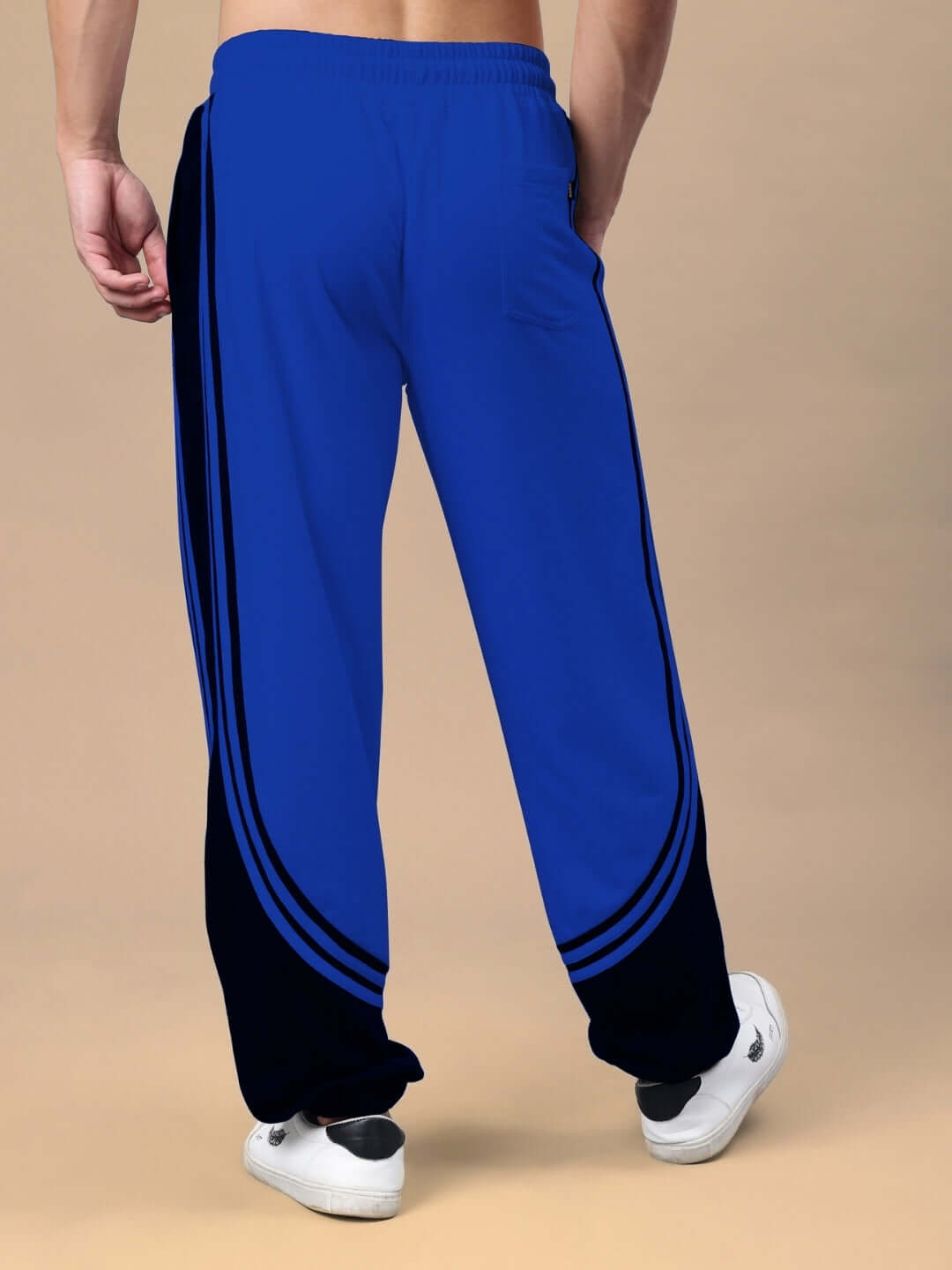 Back view of Frenzy Curve Contrast Joggers in blue and black, highlighting unique design. Made to order by DUDS, customizable fit available.