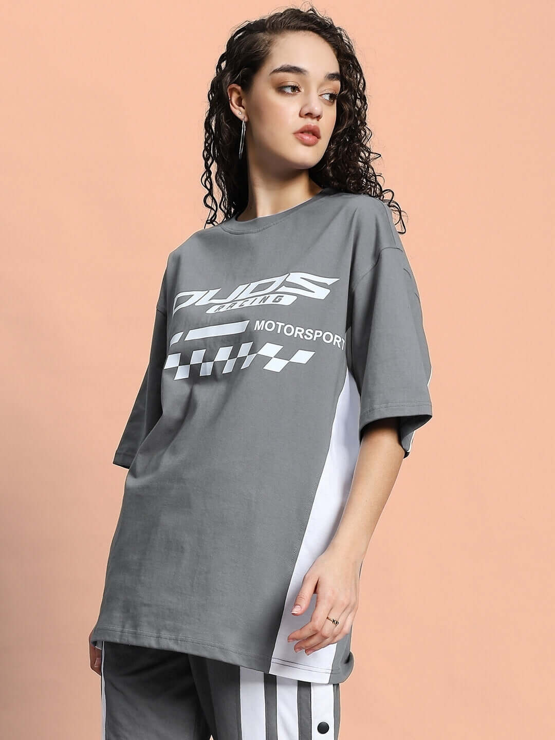 Model wearing Women's Indy Oversized Classic T-shirt in grey, made of premium cotton French terry, highlighting its casual style.