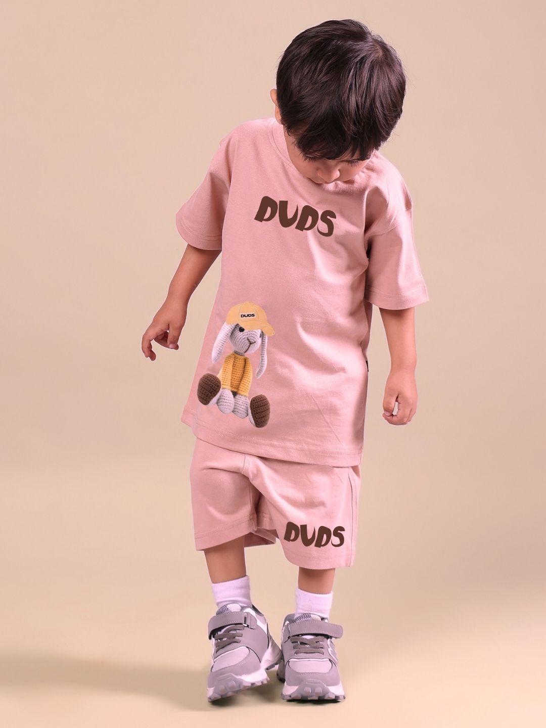 Child wearing Flint Bunny co-ord set in beige, featuring a bunny-themed design, suitable for boys and girls, standing on a neutral background.