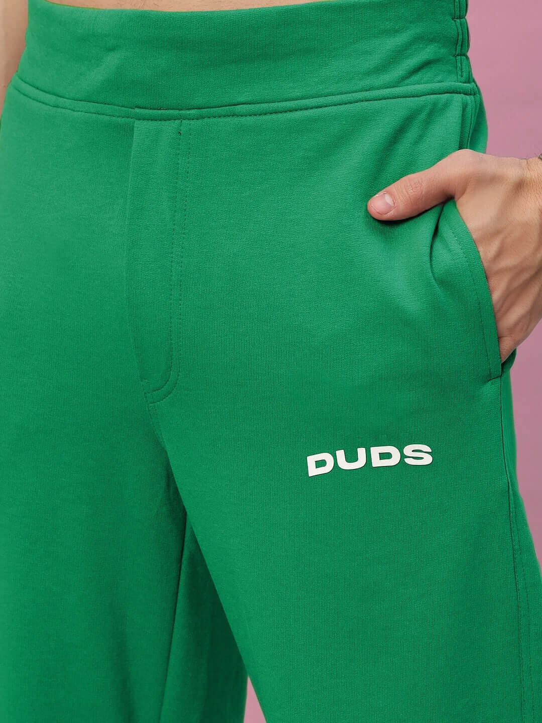 Close-up of New Era Relaxed Fit Green Joggers by DUDS, featuring a comfortable waistband and stylish pocket detail.
