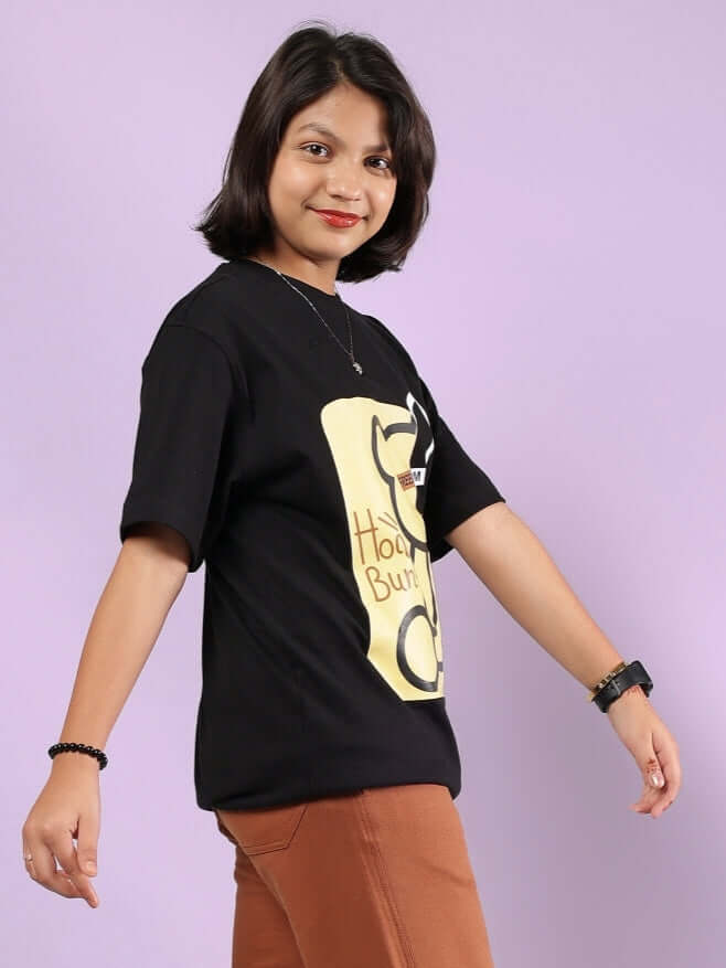 Model wearing Honey-Bunny T-shirt for boys & girls in black, featuring playful text and design; suitable for casual wear.