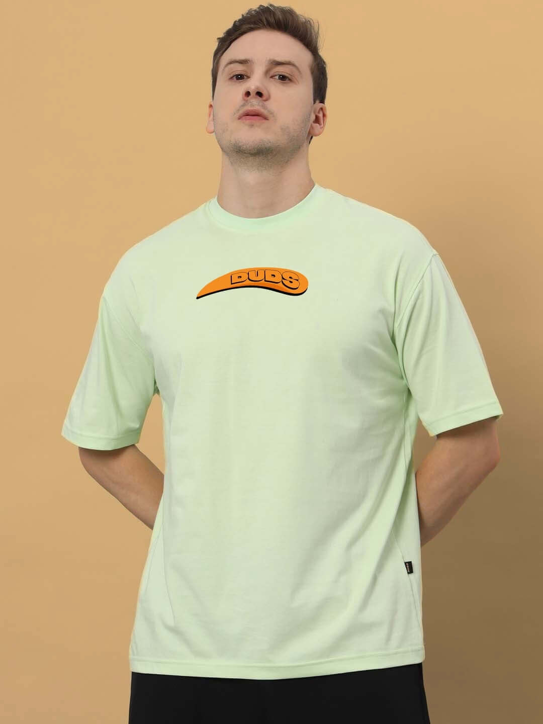 GARFIELD OVER-SIZED T-SHIRT CELERY ICE made from 100% cotton, shown on a model in premium heavy gauge fabric.