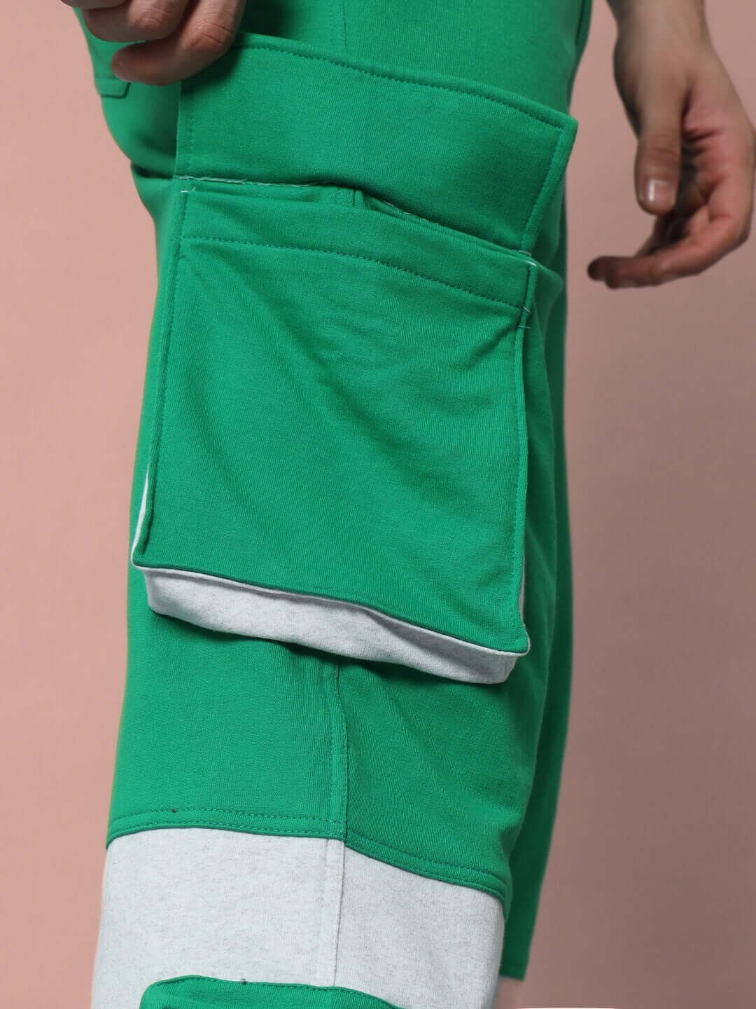 SKYSCRAPER RELAXED FIT CARGO PANT GREEN close-up view showing pocket detail.