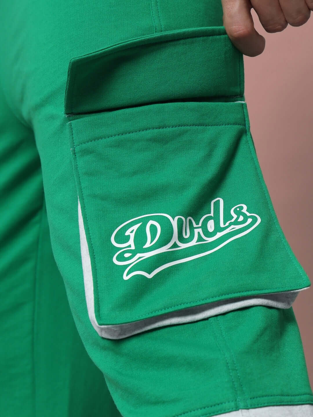 Close-up of Duds SKYSCRAPER RELAXED FIT CARGO PANT GREEN with pocket detail.