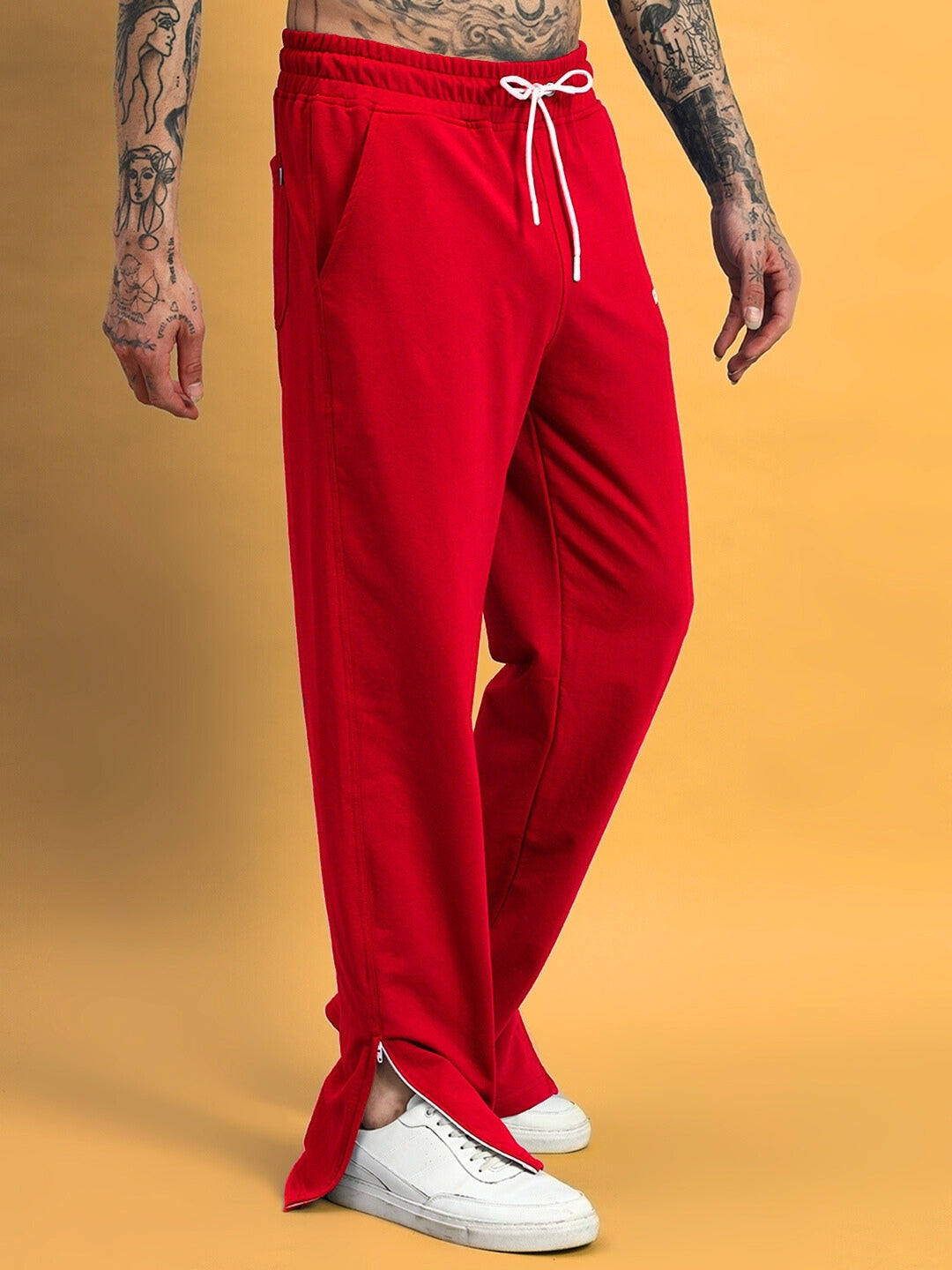 Red Hershey side slit joggers by DUDS, featuring customizable fit and made-to-order by skilled tailors for premium comfort.