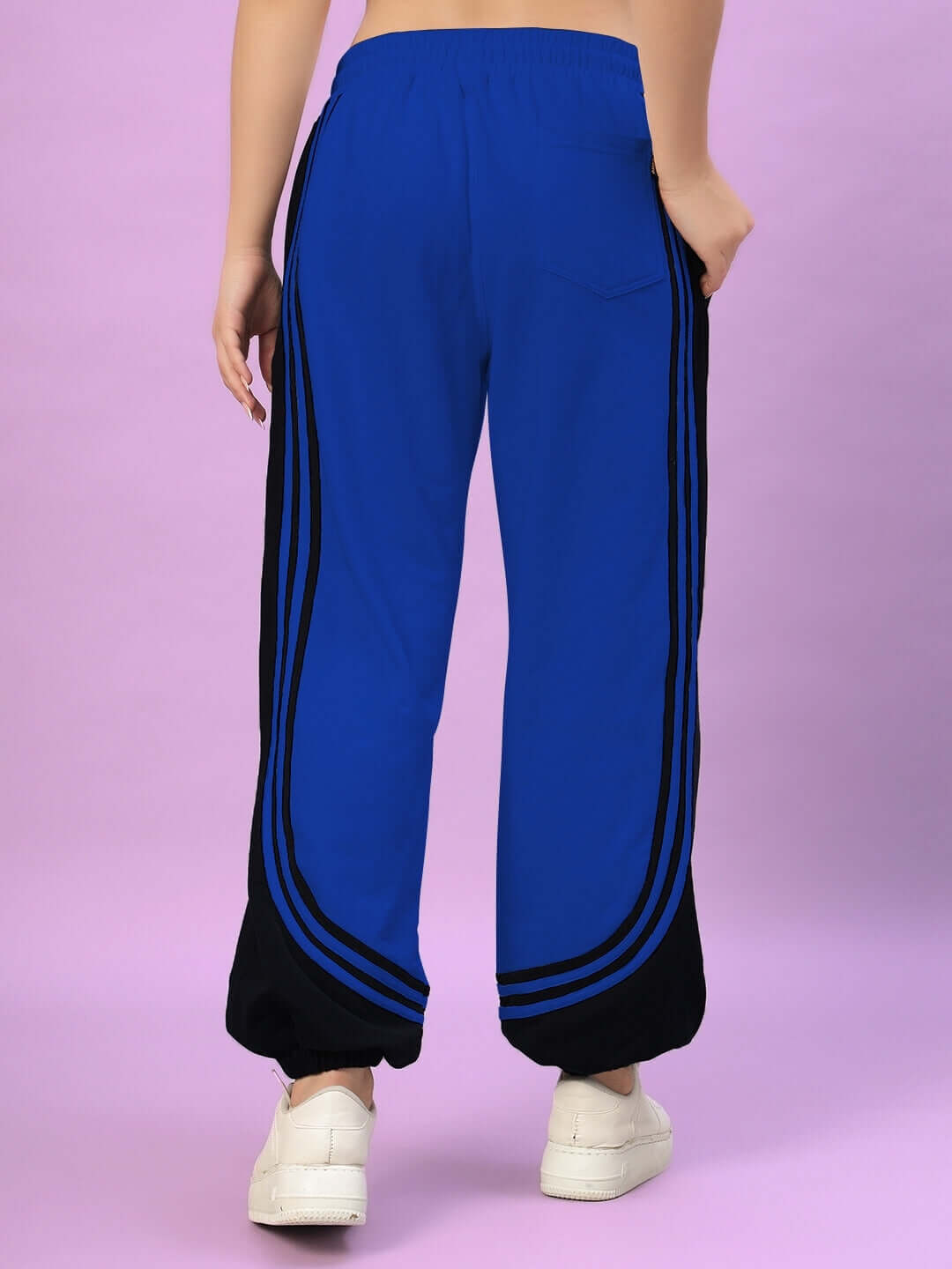 Women's Frenzy Curve Contrast Joggers in Blue and Black, shown from the back, highlighting the stylish stripe design and comfortable fit.