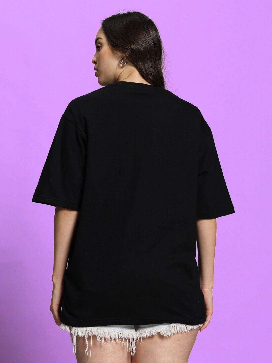 Woman wearing Women's Allonzo Black Over-Sized T-Shirt, back view. Made from premium cotton French Terry Lycra. Stylish and comfortable fit.