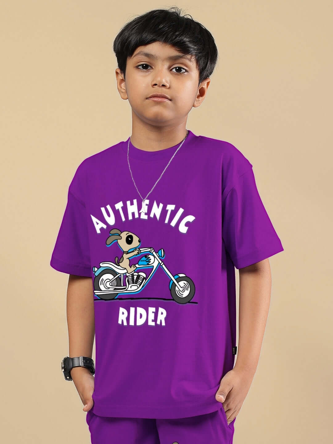 Boy wearing purple Authentic Rider T-shirt with a motorcycle print, designed for boys and girls.