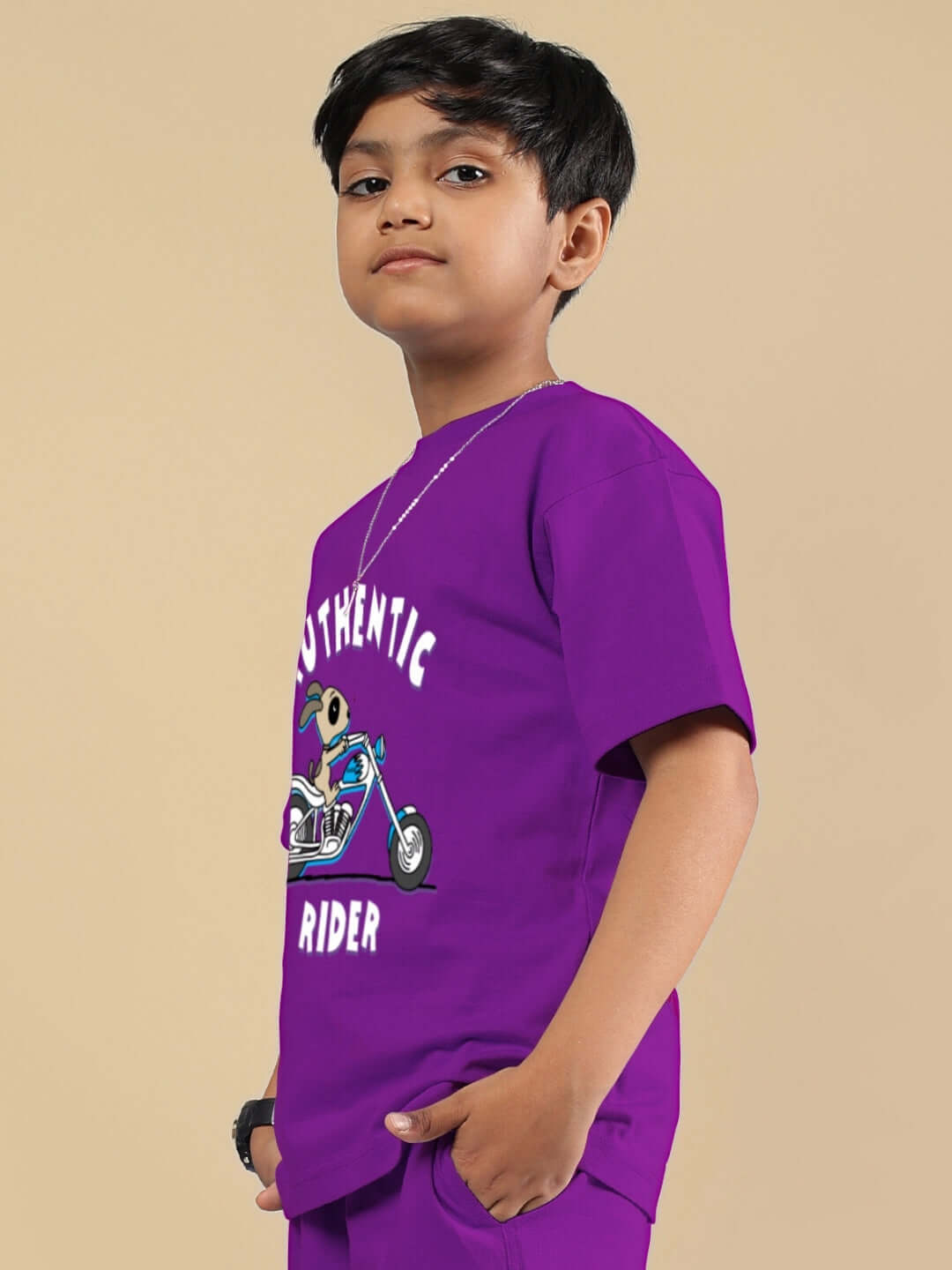 Boy wearing purple Authentic Rider T-shirt with motorcycle graphic, available for boys and girls, custom fit option by DUDS.