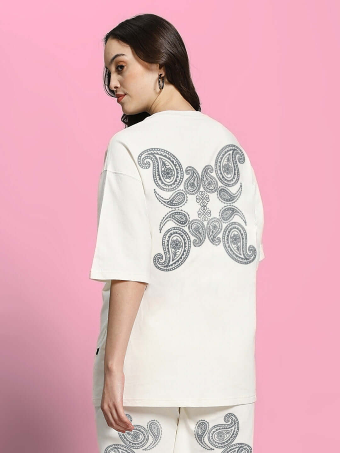 Women's off-white oversized T-shirt featuring a paisley print design, made from premium cotton French terry blend, worn by a model.