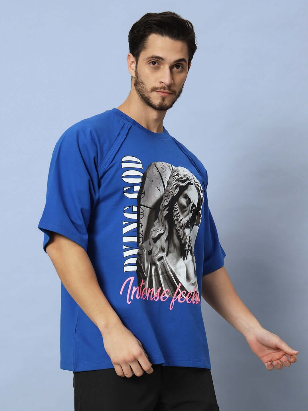 REGLAN DYING GOD OVER-SIZED T-SHIRT ROYAL BLUE featuring intense graphic design, made with premium cotton fabric for comfort.