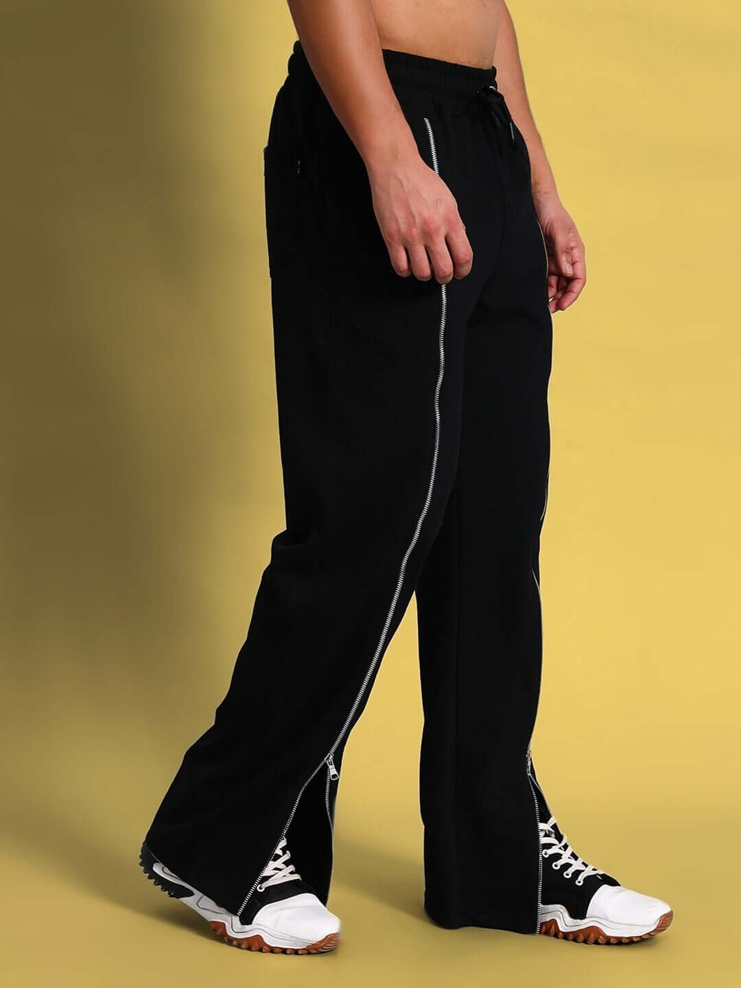 Model wearing Brazo Front Open Zipper Joggers Black, showcasing the front zipper detail and sleek streetwear style.