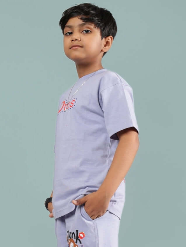 Child wearing a lavender Sammy T-shirt by DUDS, made for boys and girls, showcasing style and comfort.
