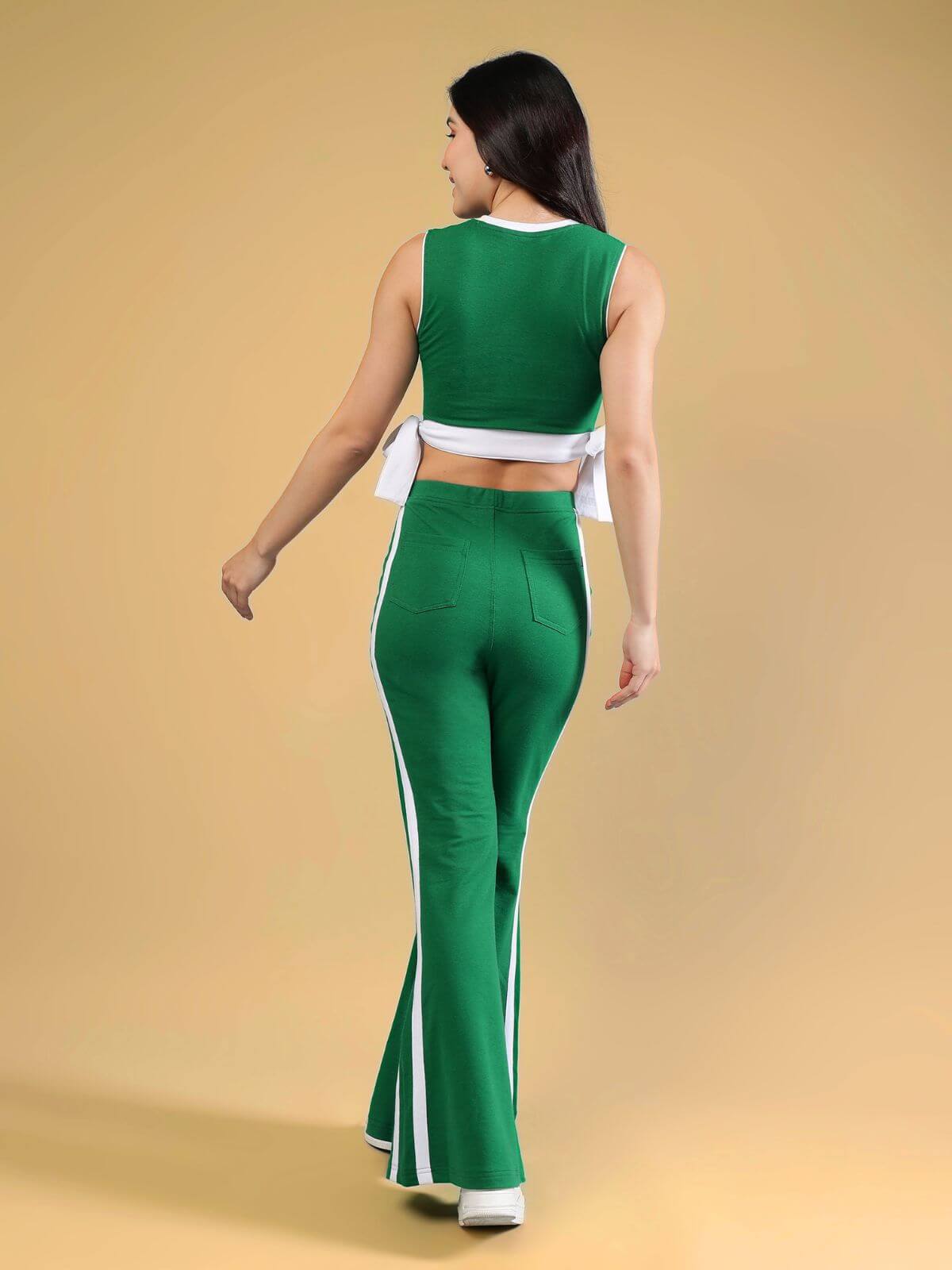 WOMENS FITTONIA COOL CO-ORD SET GREEN featuring a fitted crop top and wide-flare joggers in green color.