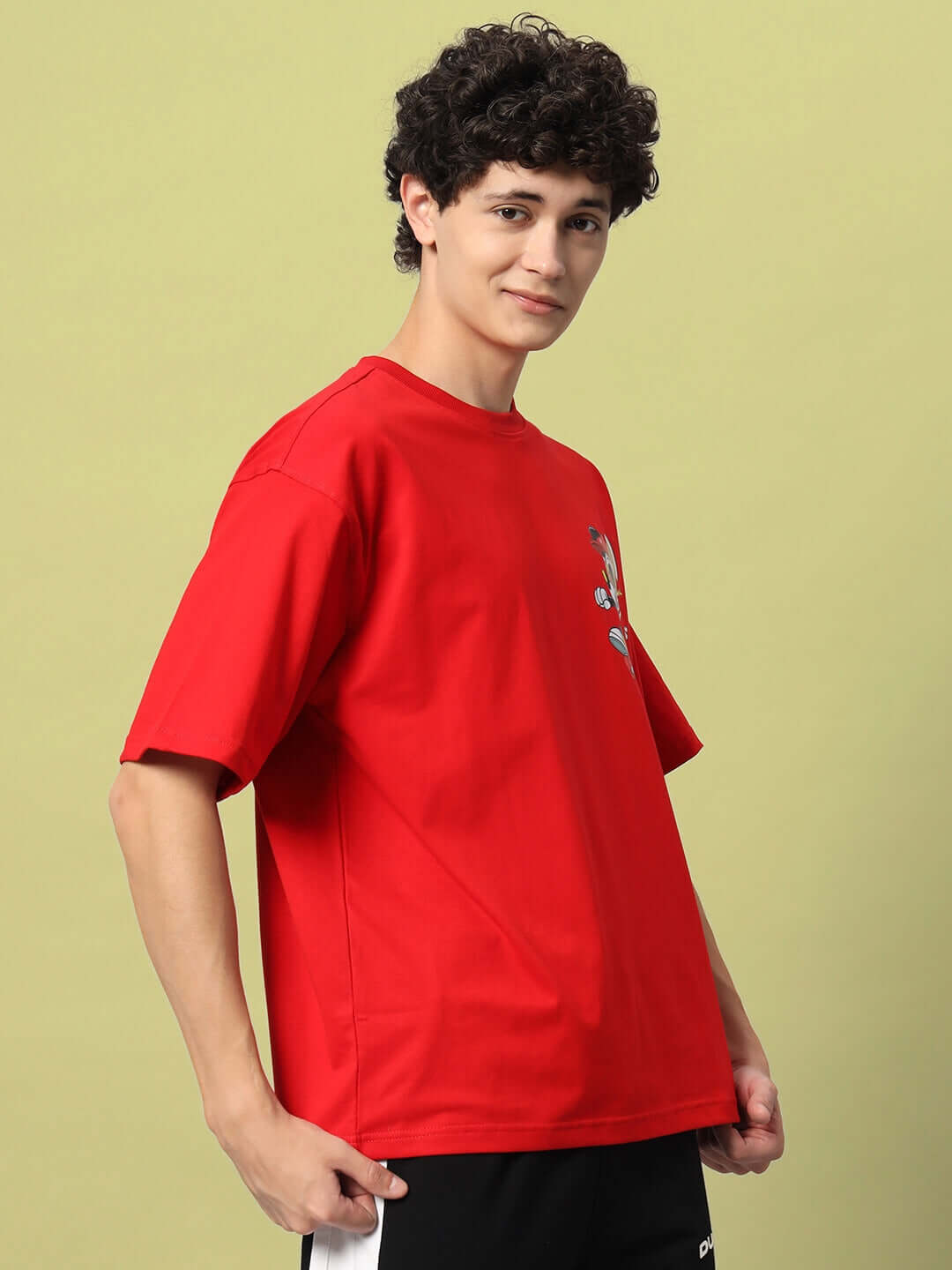 Man wearing a MICKEY COTTON OVER-SIZED T-SHIRT RED poses against a plain background.