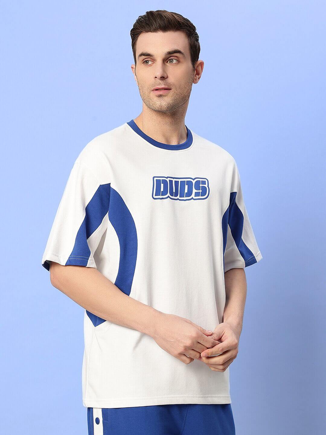 Man wearing EZEL OVER-SIZED T-SHIRT WHITE-BLUE, premium cotton fabric for streetwear style, comfort, and durability.