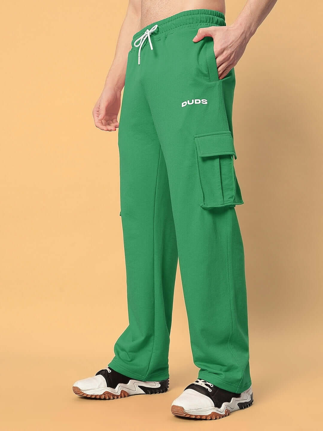 Green relaxed fit joggers with five pockets by DUDS, showcasing a casual design and comfortable waistband, available for custom size.