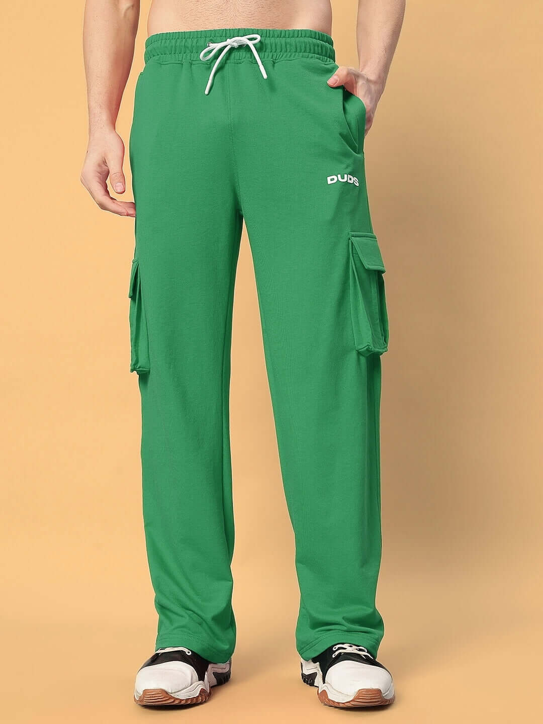 Model wearing green JESS 5 Pocket Relaxed Fit Joggers by DUDS, showcasing the casual and comfortable design, perfect for customization.