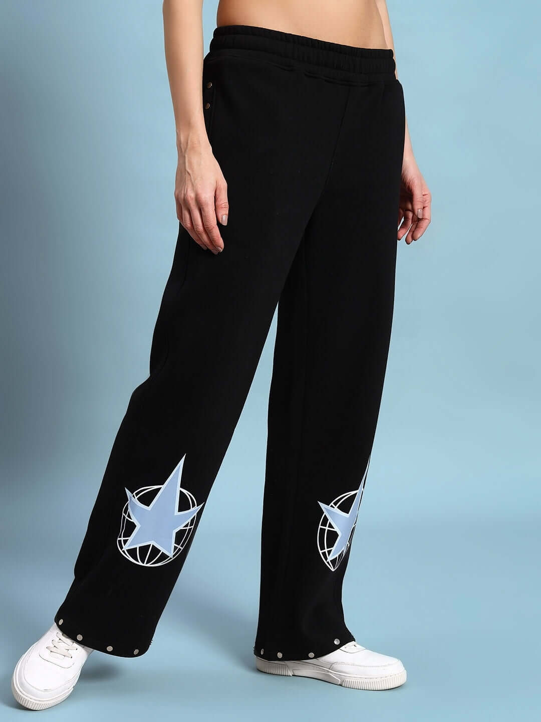 Women's black fleece jogger pants with star design, comfortable and stylish, perfect for lounging and cooler weather.