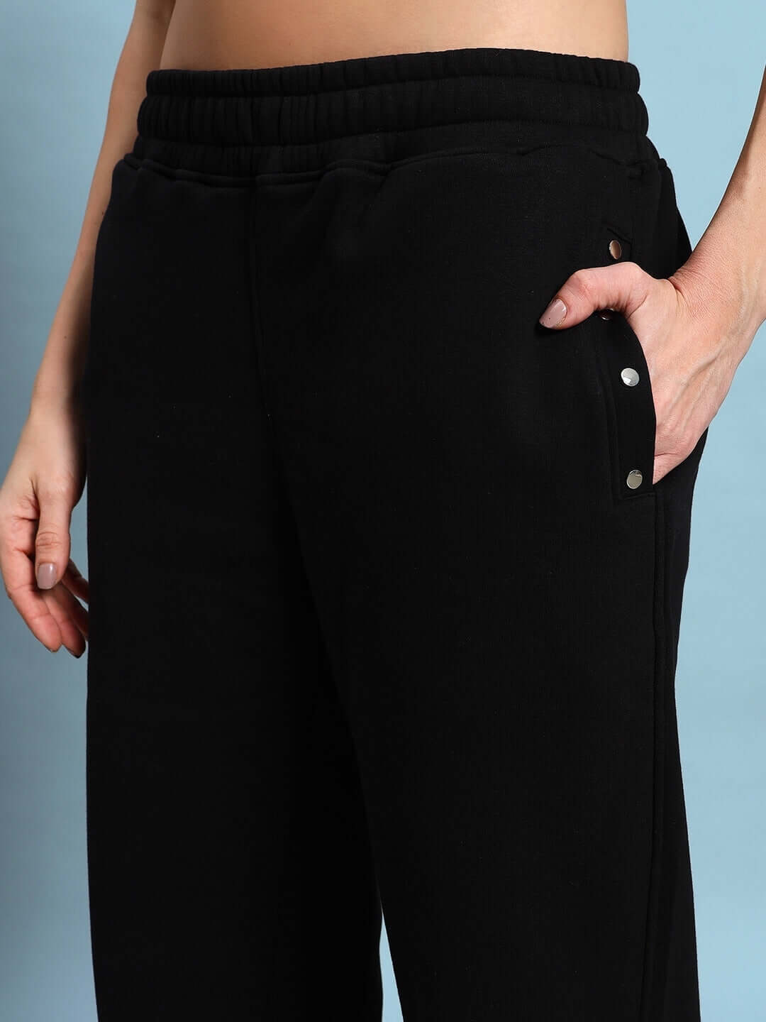 Close-up of black Women's Global Fleece Joggers showcasing soft fleece fabric and modern design details for ultimate comfort.