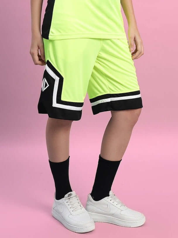 Women's Armado Regular Fit Shorts in Neon Green with black accents, customizable sizing available, shown on a model against a pink background.