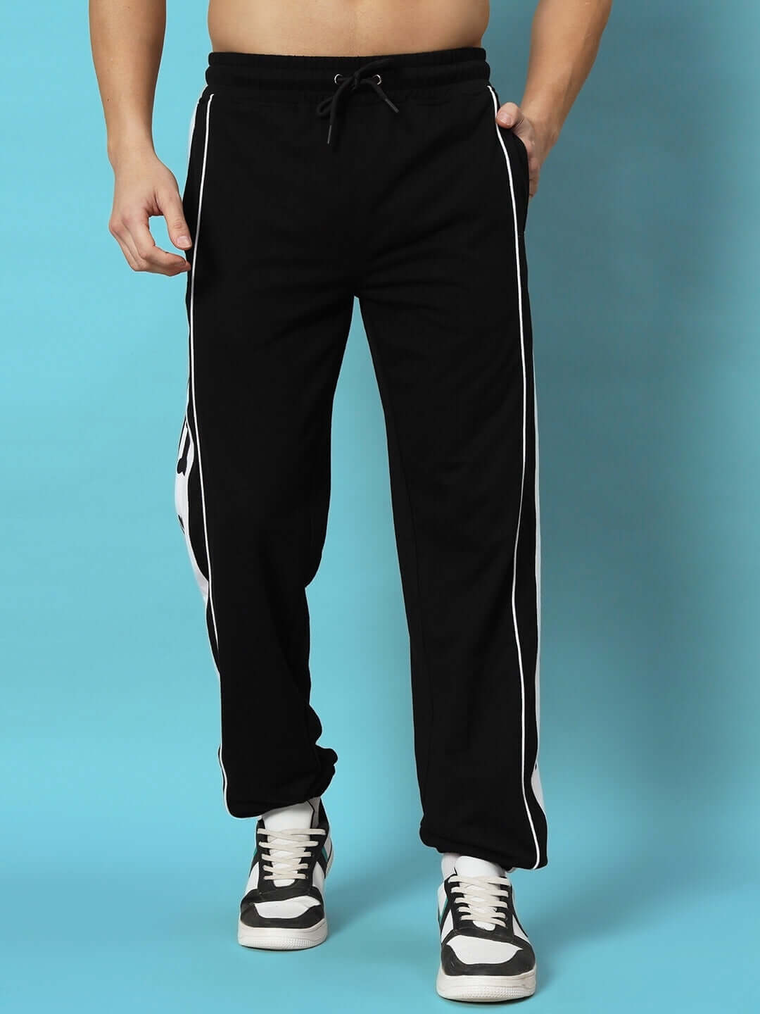 TIBIA CONTRAST PANEL JOGGERS BLACK with white side stripes, made by experienced tailors. Ideal for stylish comfort.