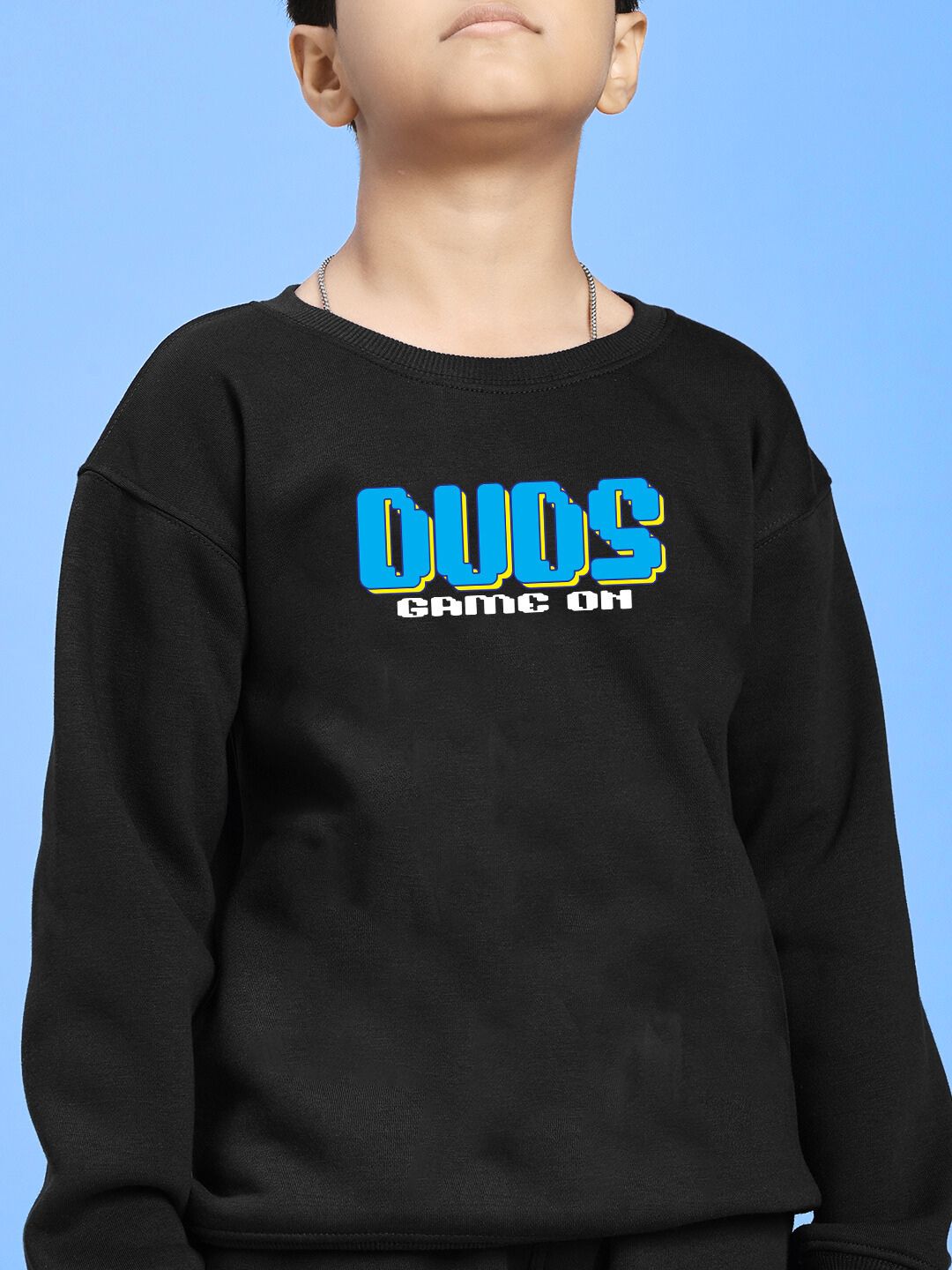 Kid wearing GAME ON PRINT FLEECE SWEATSHIRT FOR BOYS GIRLS BLACK with playful graphic design and streetwear vibe.