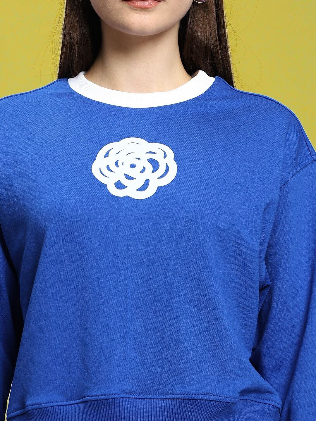 Royal blue women's relaxed fit sweatshirt with white floral design, made from premium cotton French Terry. Comfortable and stylish casual wear.