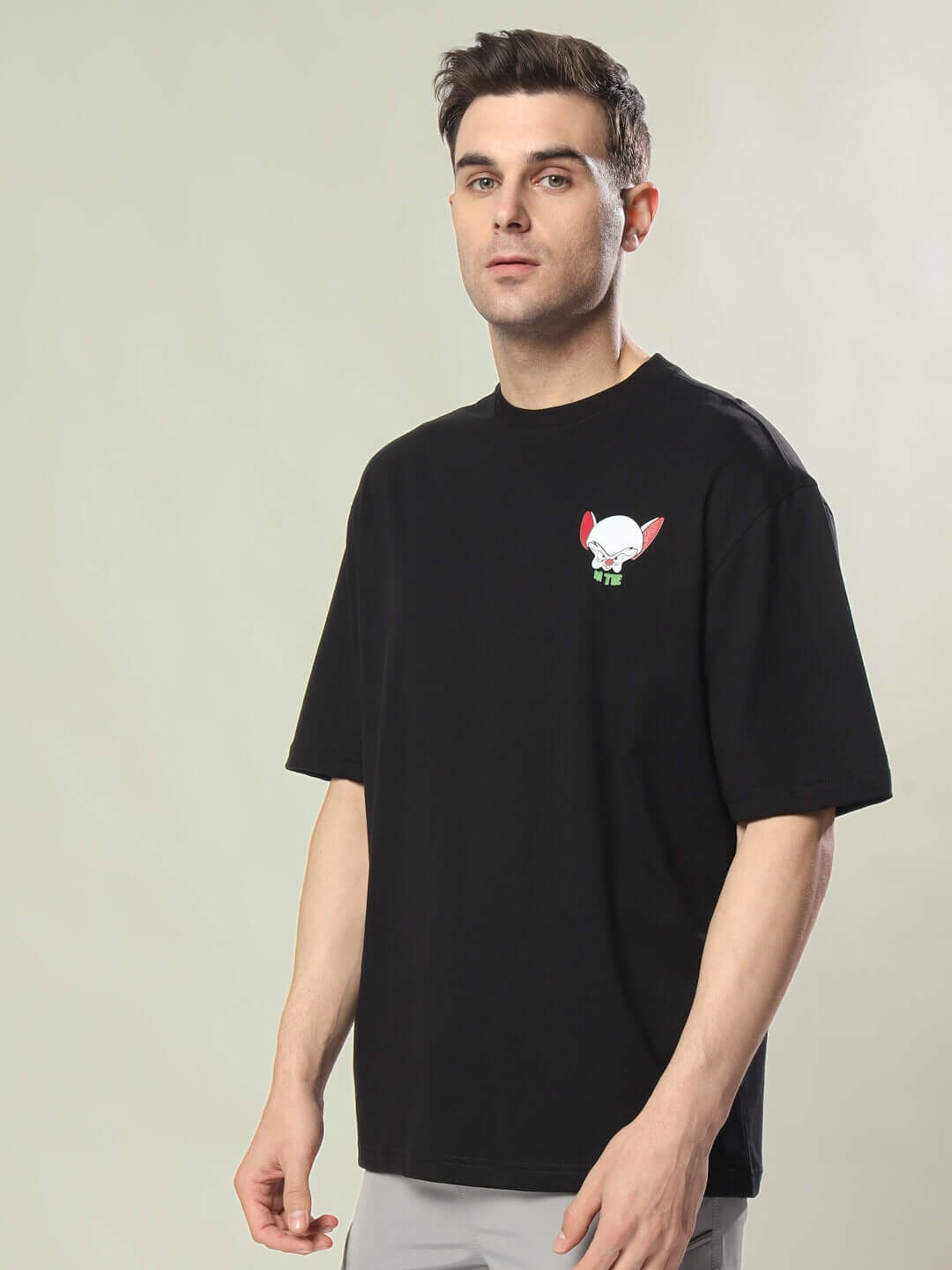 Alt Tag: INSANE BRAIN OVER-SIZED T-SHIRT BLACK on model, showing front view. Features comfort and customizable fit options.