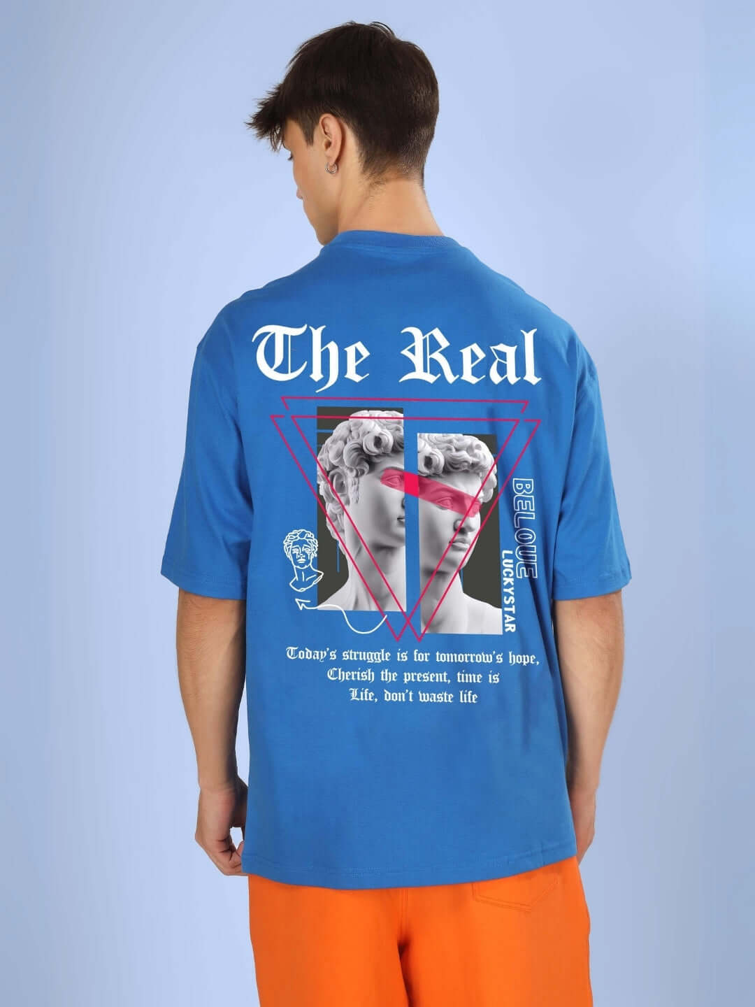 Back view of LUCKYSTAR OVER-SIZED T-SHIRT ROYAL BLUE with unique design and print, worn by a model. Custom fit options available.