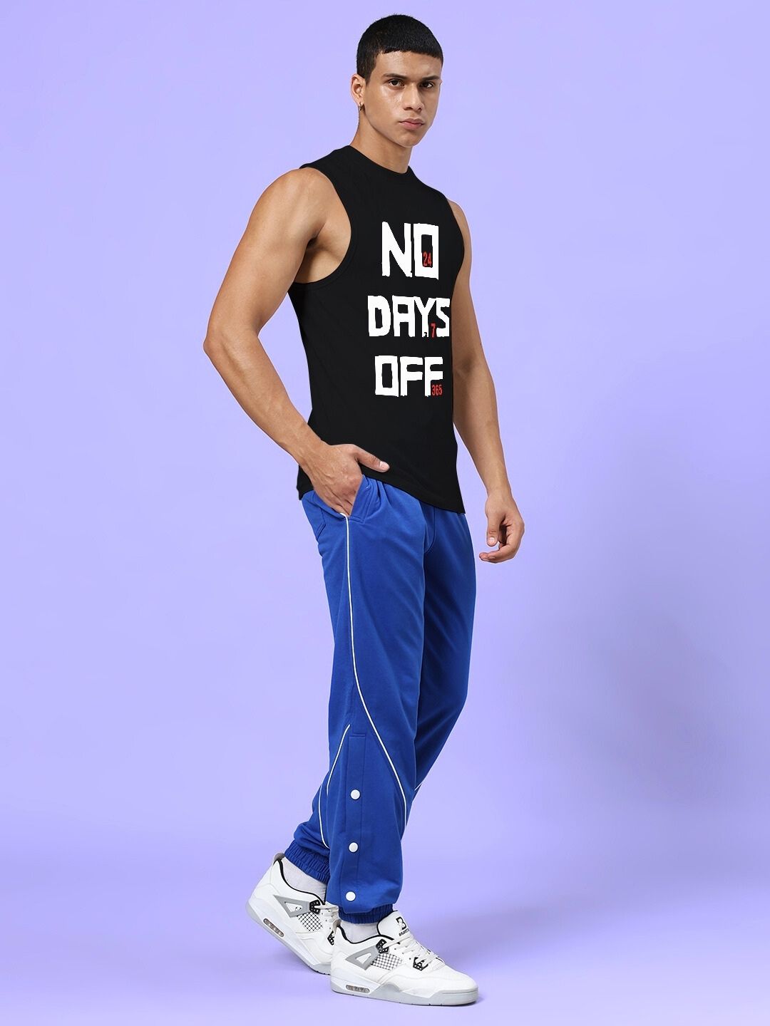 Man wearing NO DAYS OFF GYM CO-ORD SET BLACK ROYAL BLUE showcasing fitness style and performance.
