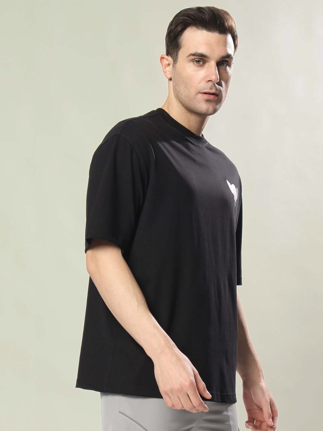 Model wearing INSANE BRAIN OVER-SIZED T-SHIRT BLACK, showcasing casual fit