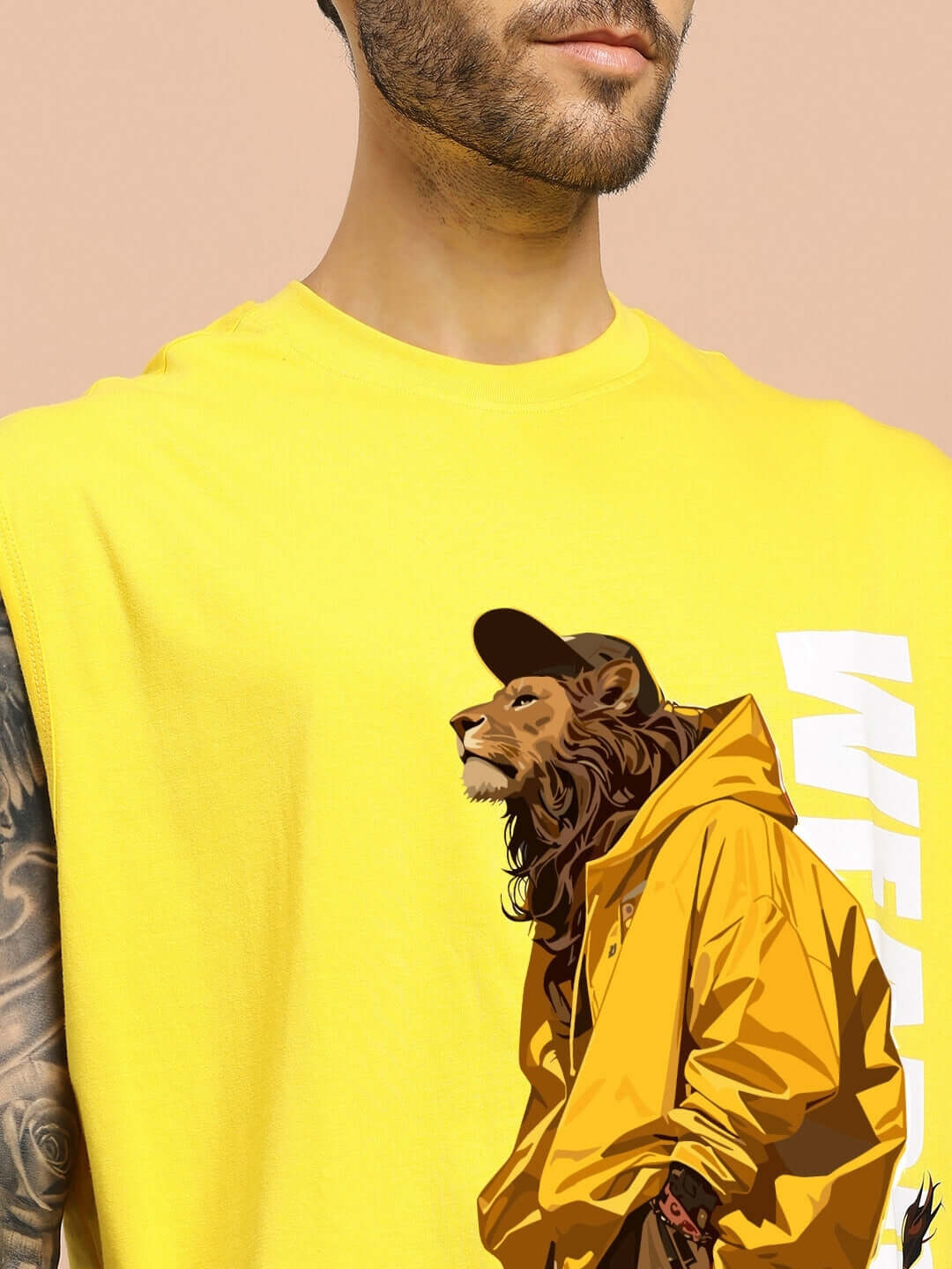 Man wearing yellow STREET LION GYM T-SHIRT featuring lion graphic, showcasing gym style and custom fit options by DUDS.