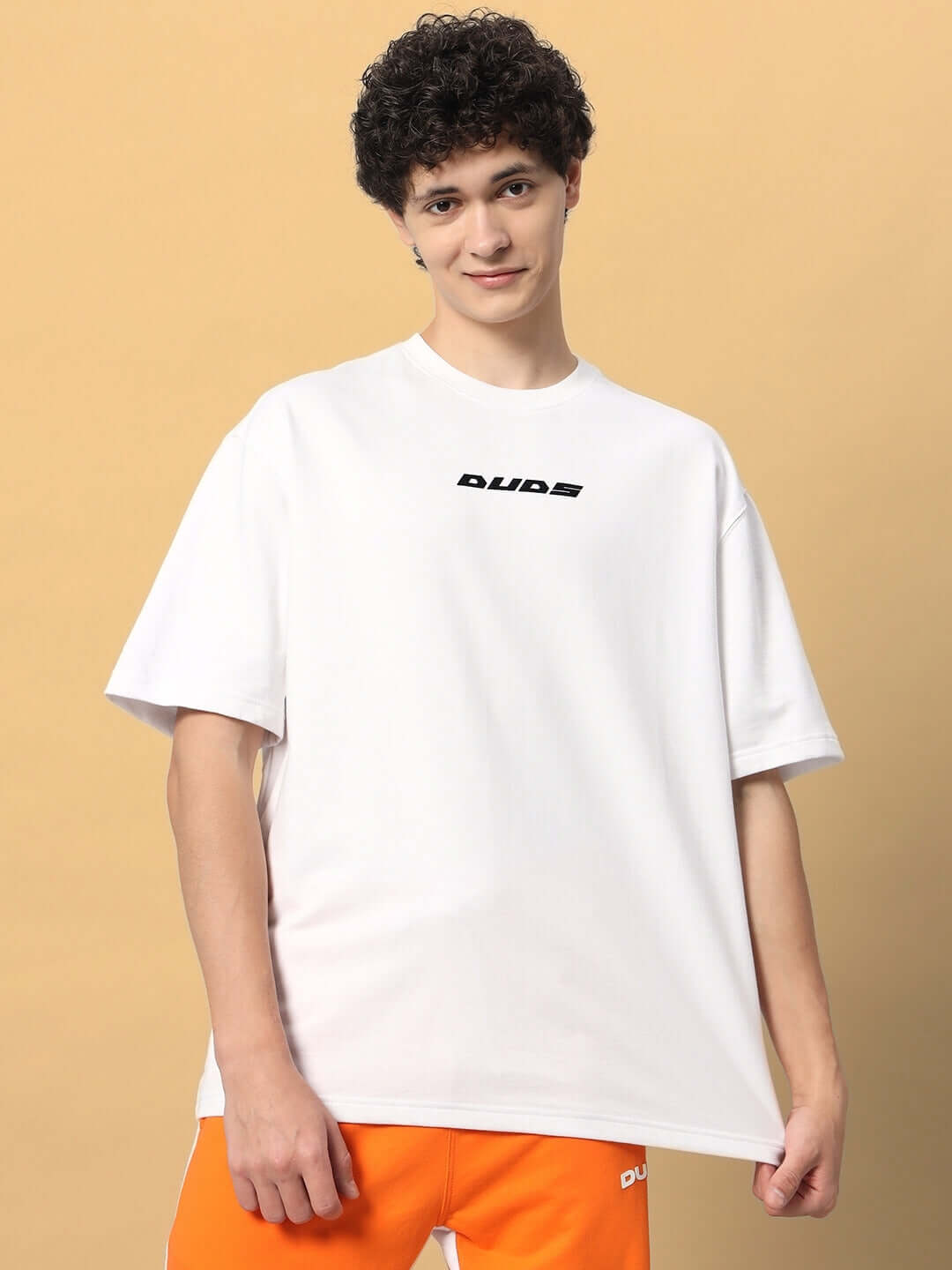 Model wearing EIGHTFOLD PATH OVER-SIZED T-SHIRT WHITE made from premium heavy gauge fabric, 97% cotton and 3% elastane.
