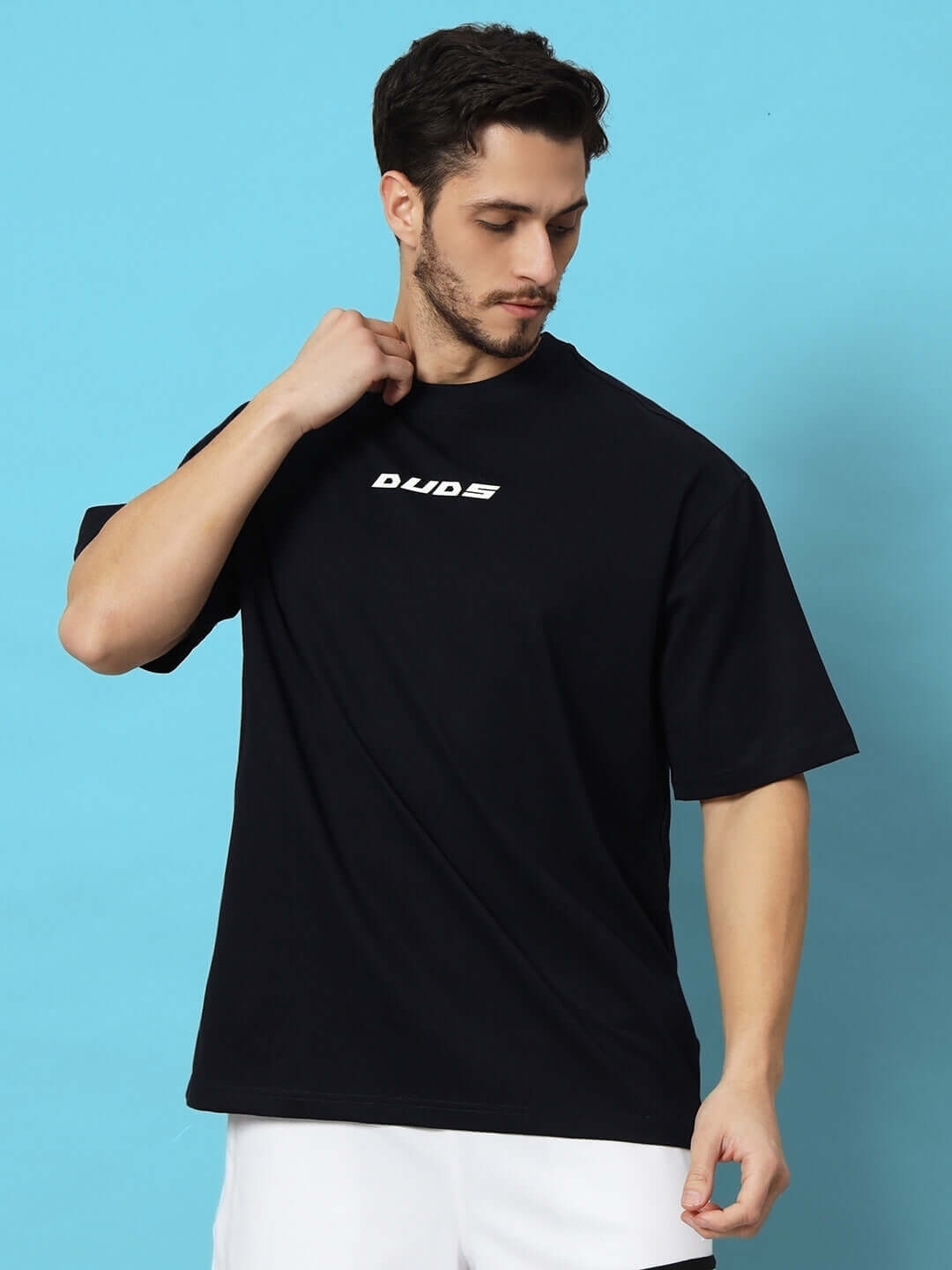 Man wearing FLAME HOWL OVER-SIZED T-SHIRT NAVY BLUE with DUDS logo