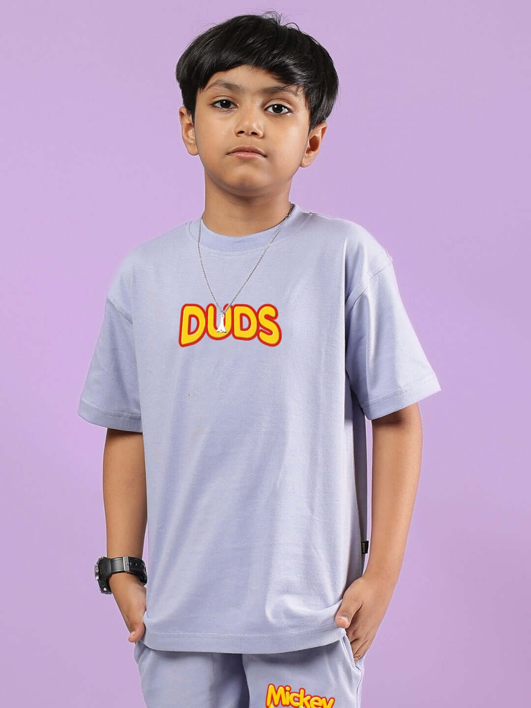 Child wearing lavender Mickey Dingo t-shirt by DUDS, displaying comfortable fit. Available for boys and girls, customizable sizes.